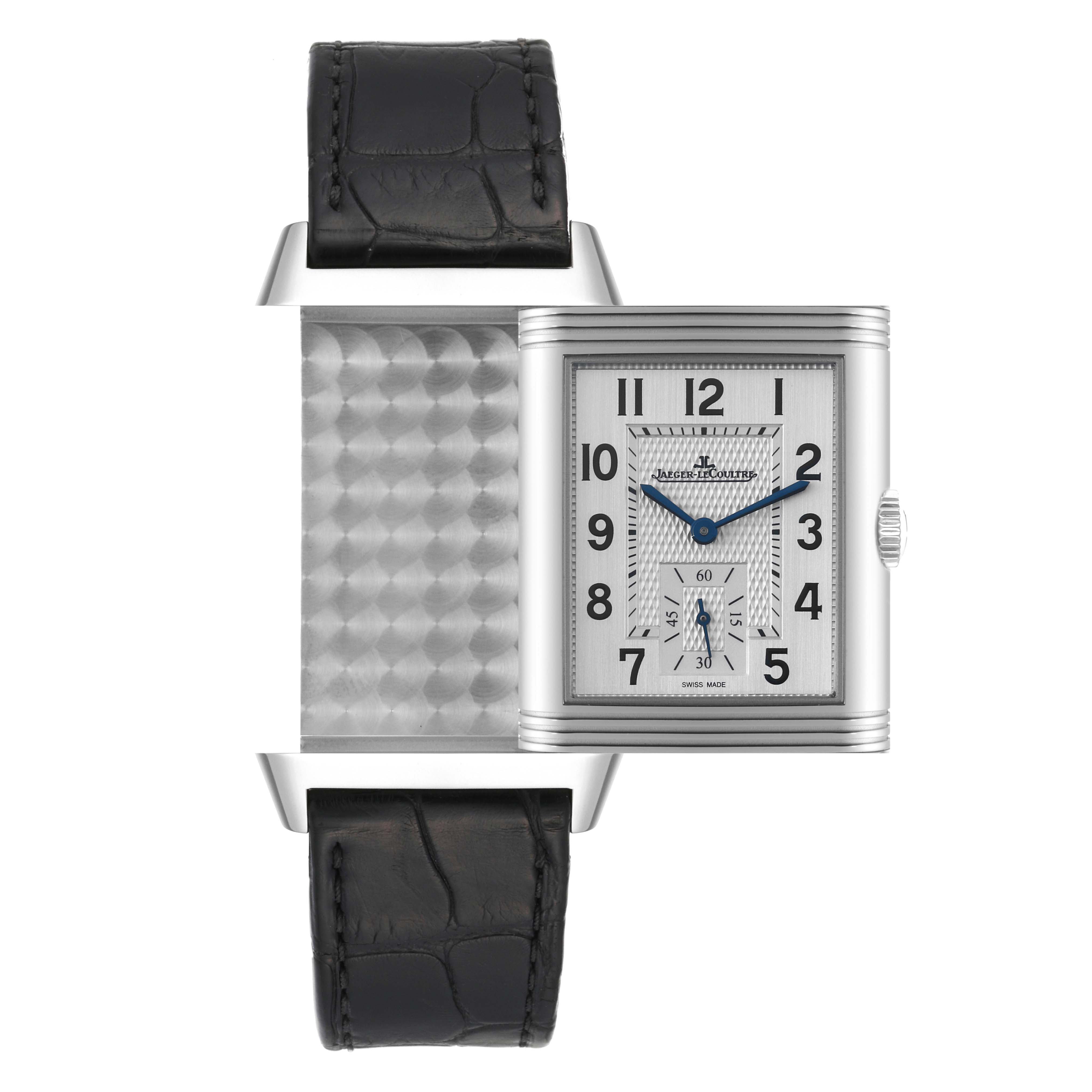 This image shows a Jaeger-LeCoultre Reverso watch with its case swiveled to expose the patterned inside and the black leather strap.