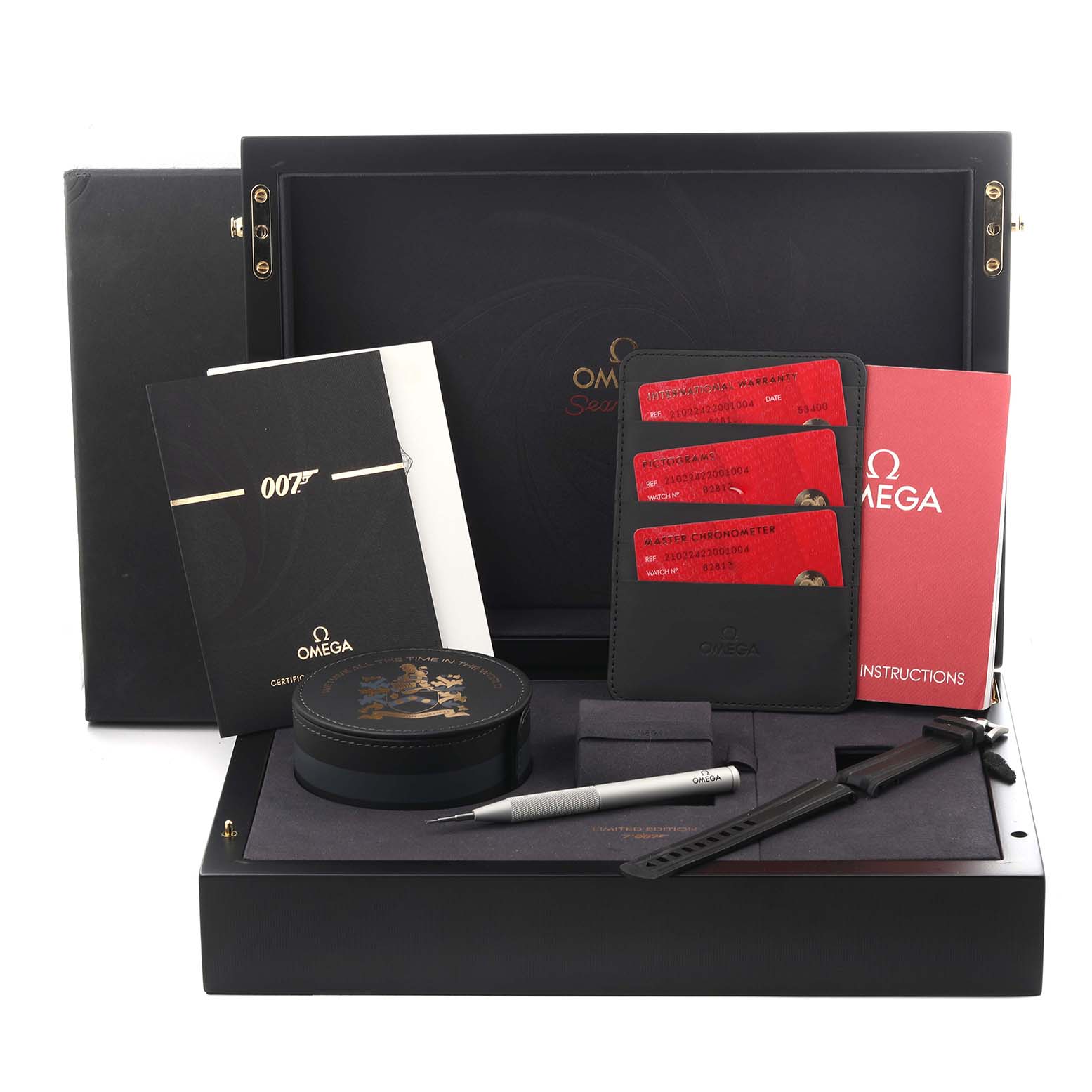 The image shows accessories for the Omega Seamaster 210.22.42.20.01.004 Men
s Stainless Steel Black Dial 210.22.42.20.01.004 Men
s Stainless Steel Black Dial watch, including a storage box, instruction manuals, cards, a pen, and a strap tool.