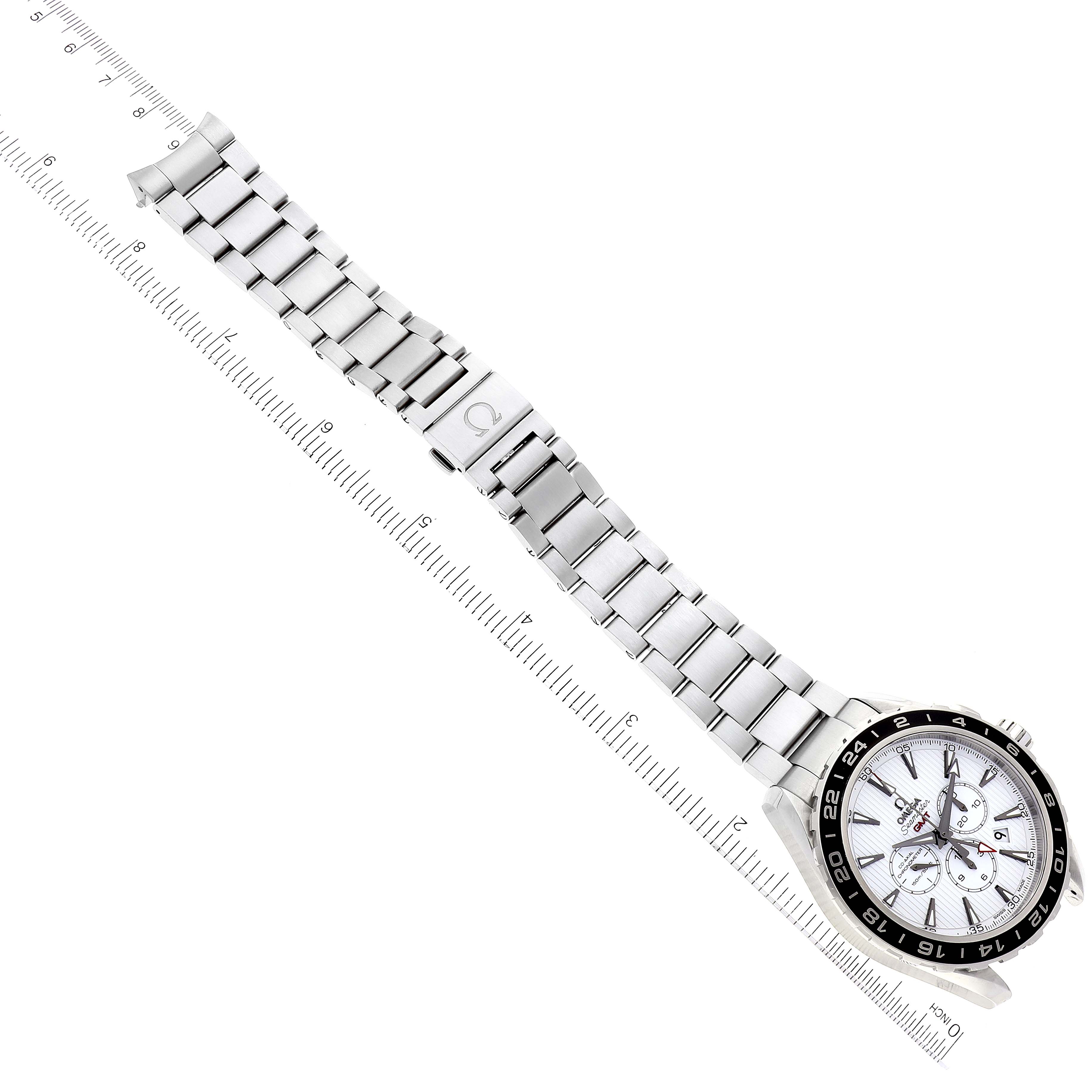 The image shows the Omega Aqua Terra 231.10.44.52.04.001 Men
s Stainless Steel White Dial 231.10.44.52.04.001 Men
s Stainless Steel White Dial watch, including its face, metal bracelet, and clasp, laid alongside a ruler for size reference.