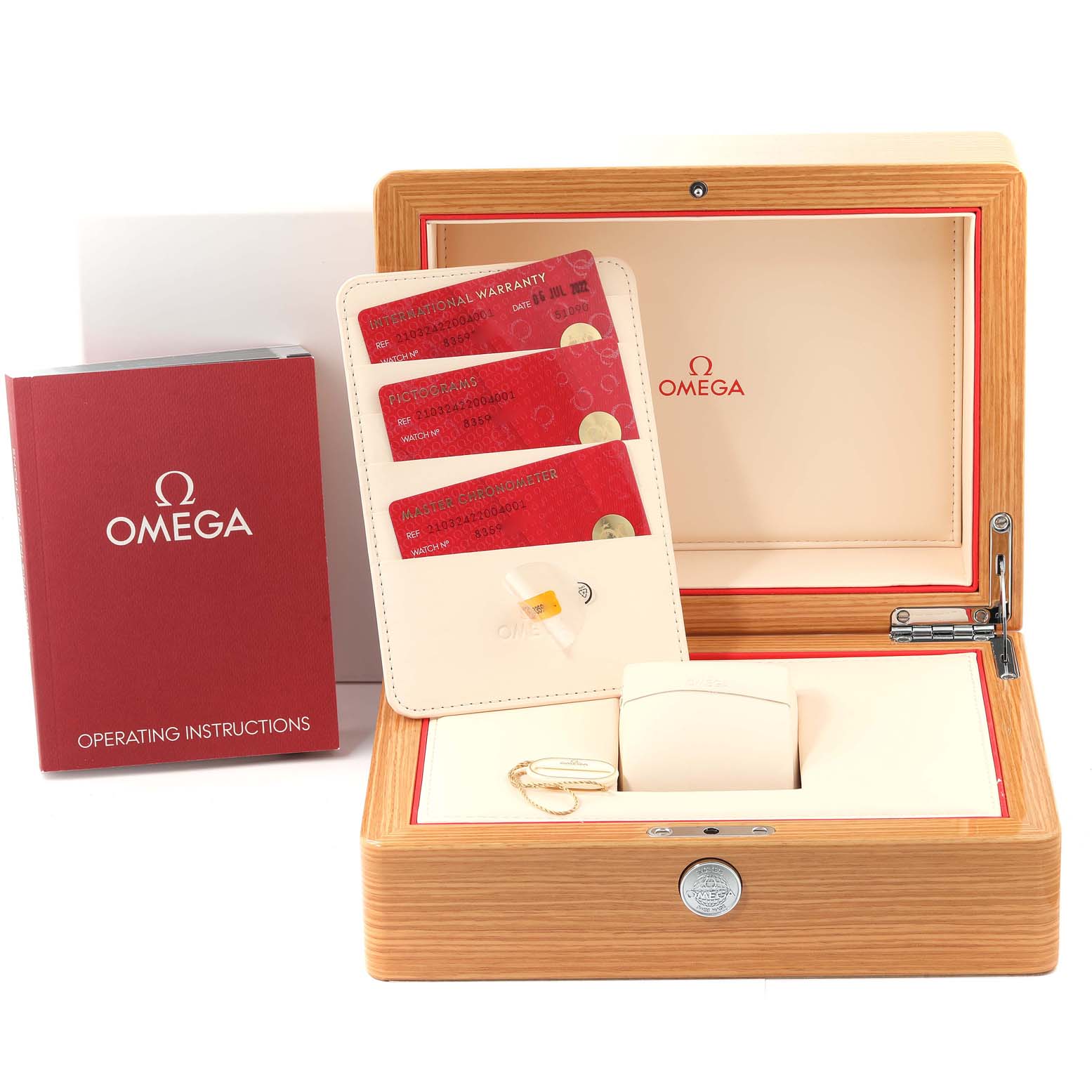The image shows an open box of an Omega Seamaster 210.32.42.20.04.001 Men's Stainless Steel White Dial 210.32.42.20.04.001 Men's Stainless Steel White Dial watch, including operating instructions and warranty cards.