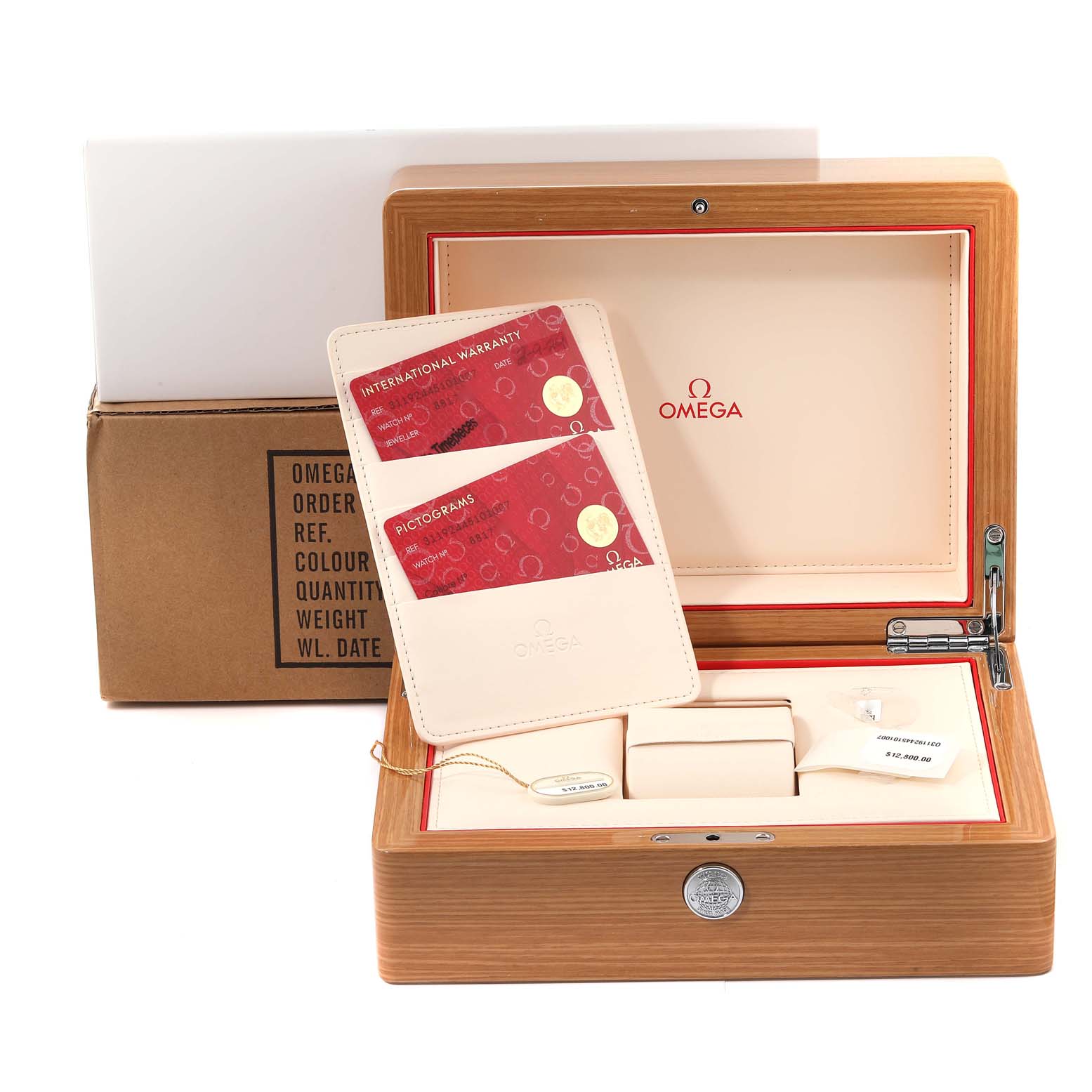 The image shows the packaging and accessories of an Omega Speedmaster 311.92.44.51.01.007 Men's Ceramic Black Dial 311.92.44.51.01.007 Men's Ceramic Black Dial, including a box, warranty, and pictogram cards.