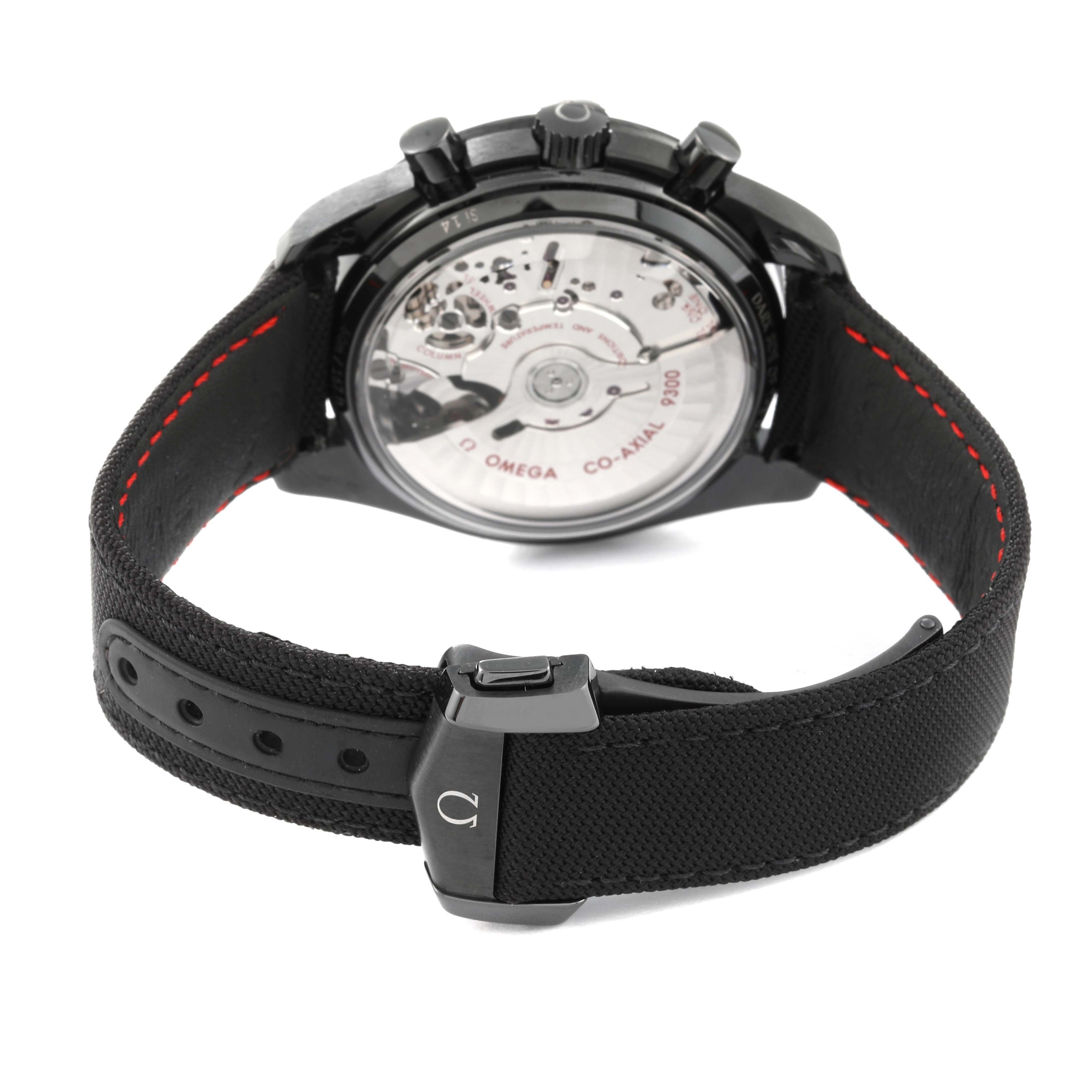 The image shows the back view of an Omega Speedmaster 311.92.44.51.01.007 Men's Ceramic Black Dial 311.92.44.51.01.007 Men's Ceramic Black Dial watch, highlighting its transparent case back and black strap with red stitching.