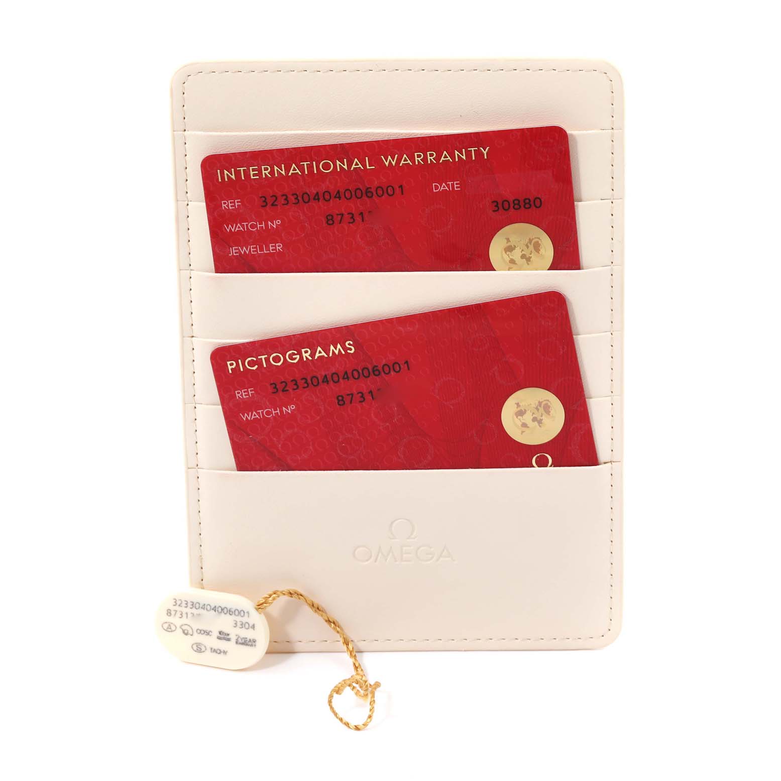 The image shows an Omega Speedmaster 323.30.40.40.06.001 Men
s Stainless Steel Grey Dial 323.30.40.40.06.001 Men
s Stainless Steel Grey Dial model
s international warranty card, pictograms card, and tag in a white holder.