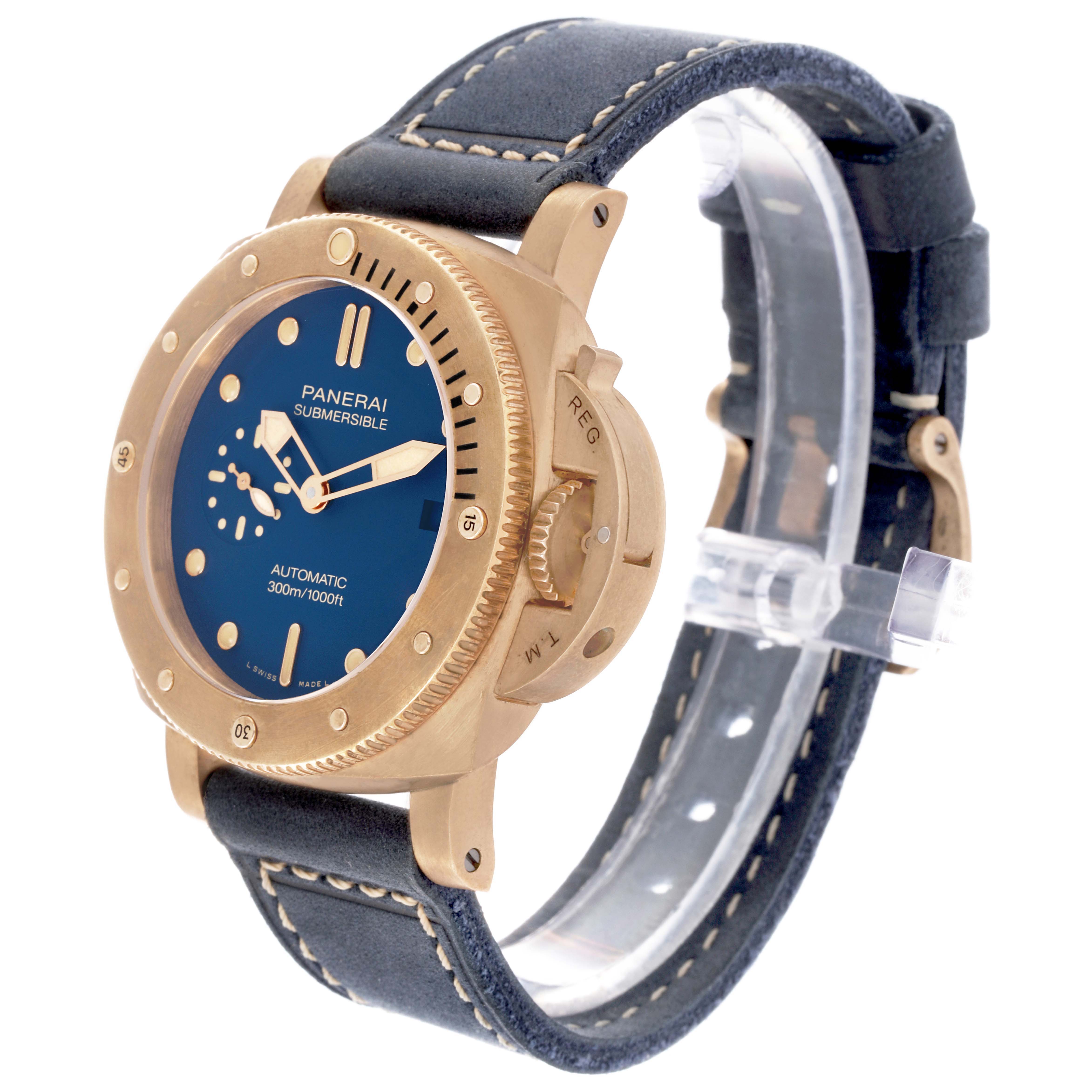 The Panerai Submersible PAM01074 Men's Bronze Blue Dial PAM01074 Men's Bronze Blue Dial watch is shown at a three-quarter angle, displaying the face, bezel, crown guard, and strap.