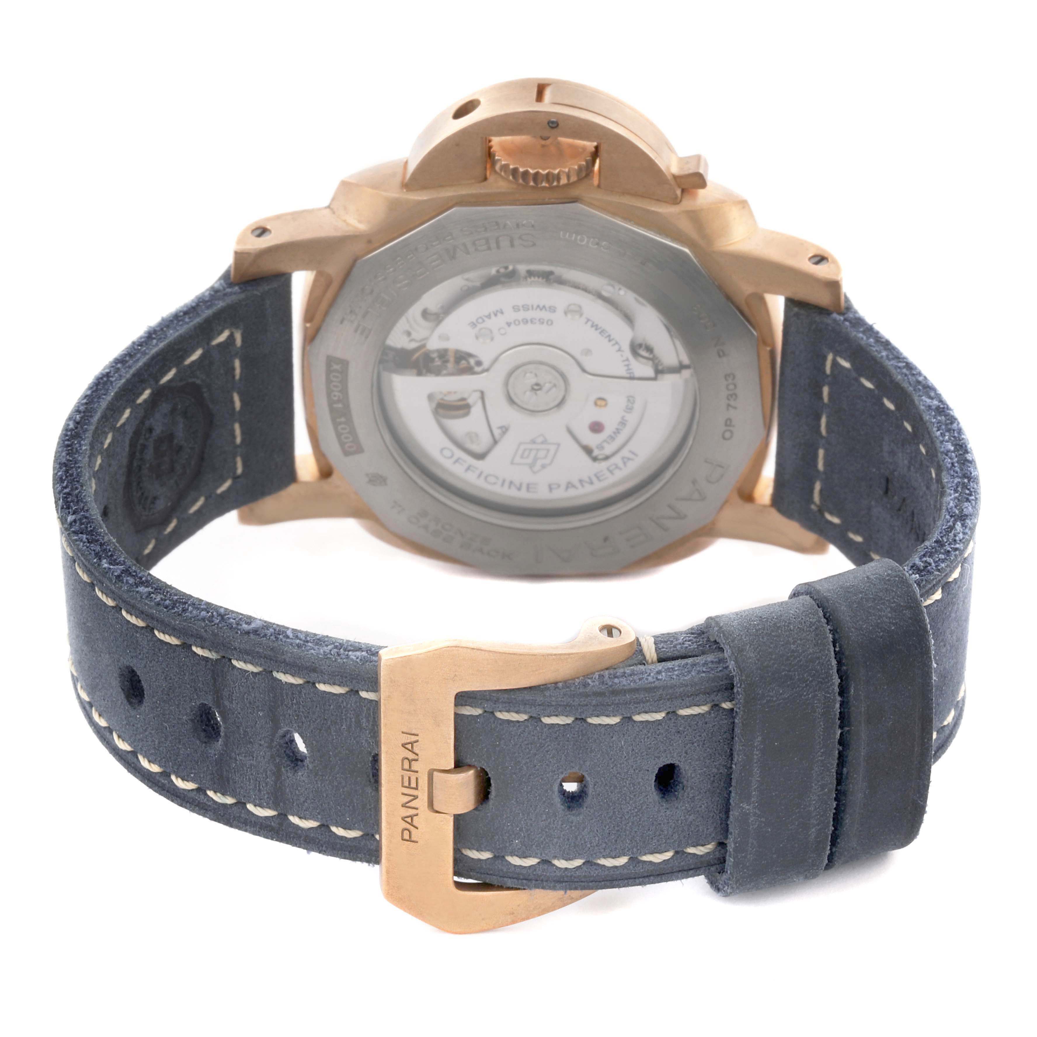The image shows the back of the Panerai Submersible PAM01074 Men's Bronze Blue Dial PAM01074 Men's Bronze Blue Dial watch, highlighting its caseback and buckle on a leather strap.