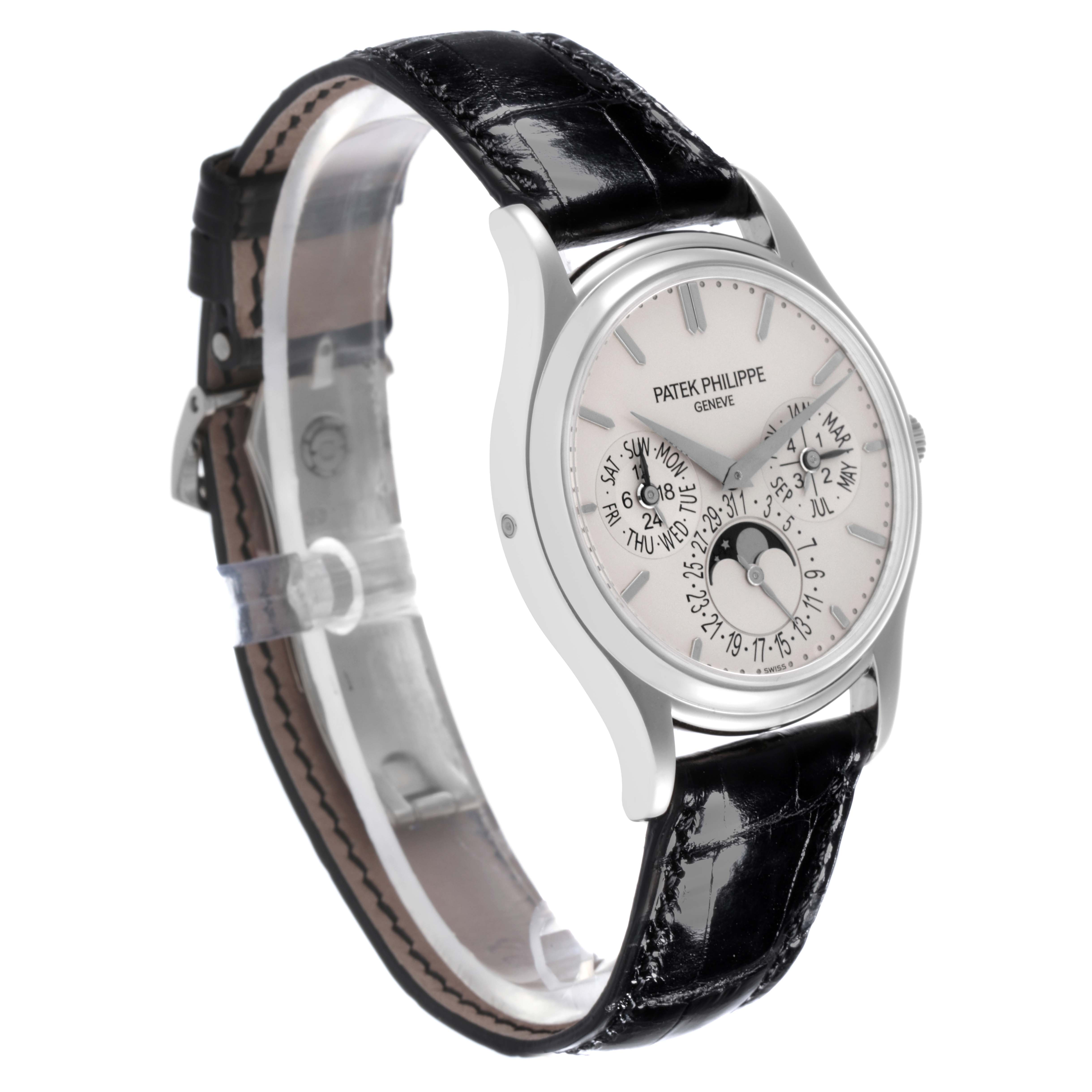 The Patek Philippe Calatrava 5140G-001 Men's White Gold Silver Dial 5140G-001 Men's White Gold Silver Dial watch is shown at a three-quarter angle, highlighting the face, case, and leather strap.