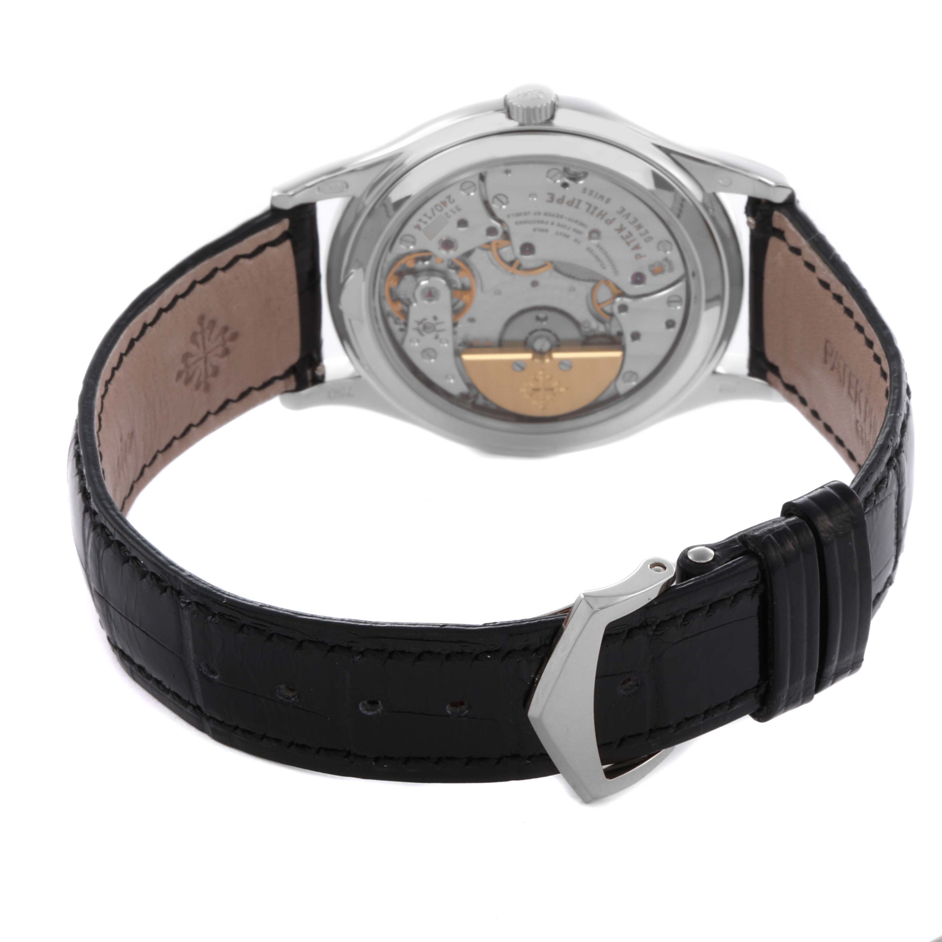 The image shows the back view of the Patek Philippe Calatrava 5140G-001 Men's White Gold Silver Dial 5140G-001 Men's White Gold Silver Dial watch, highlighting the movement and black leather strap.