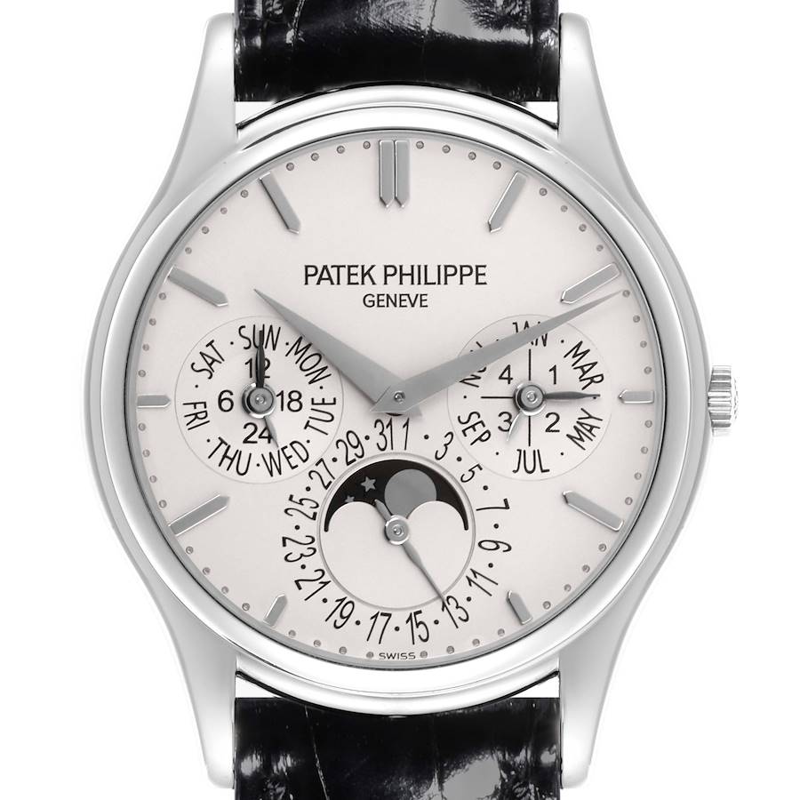 The Patek Philippe Calatrava watch is shown from a front view, displaying its dial, hands, subdials, and leather strap.