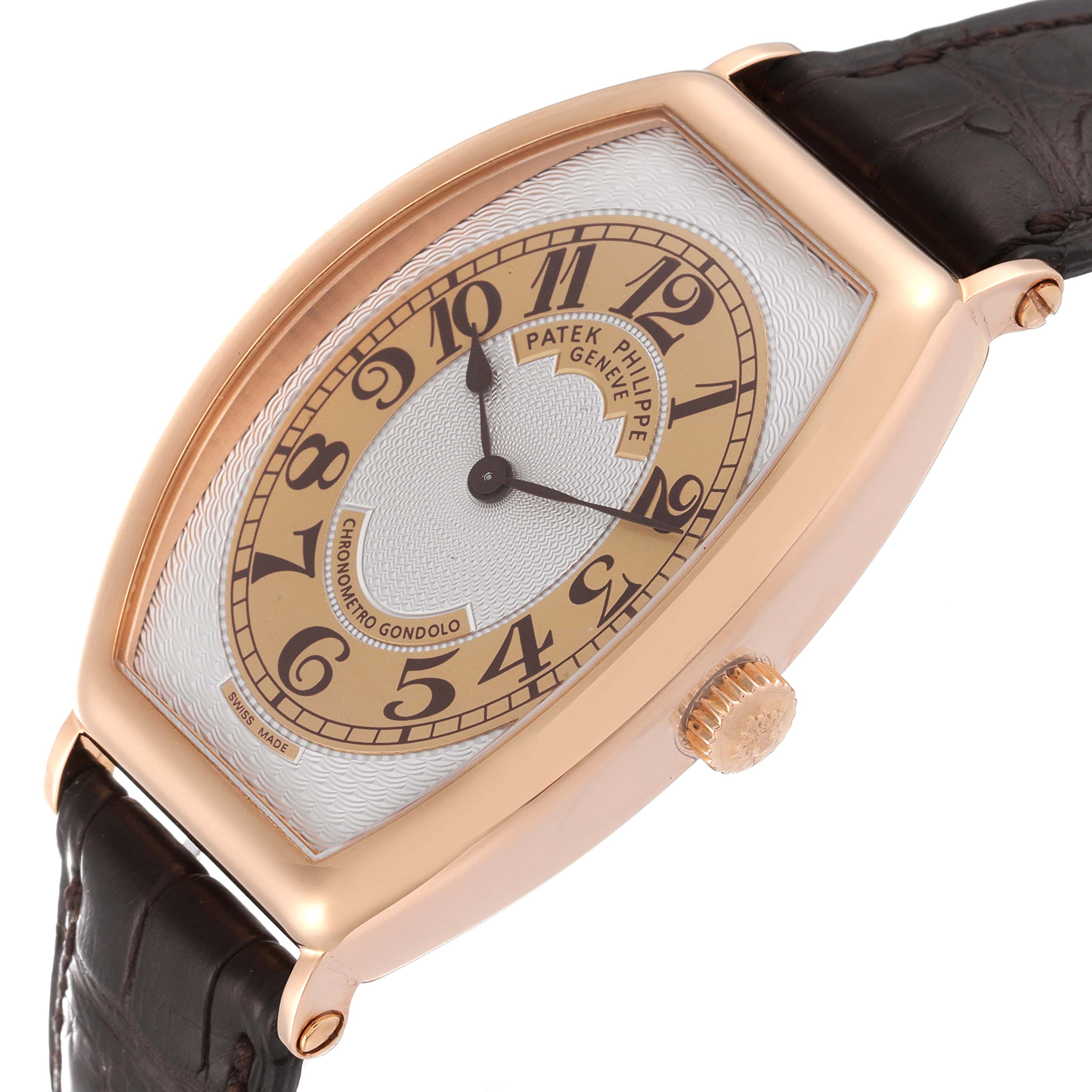 The image shows a Patek Philippe Gondolo 5098R Men
s Rose Gold Silver Dial 5098R Men
s Rose Gold Silver Dial watch at an angle highlighting the face, bezel, crown, and leather strap.