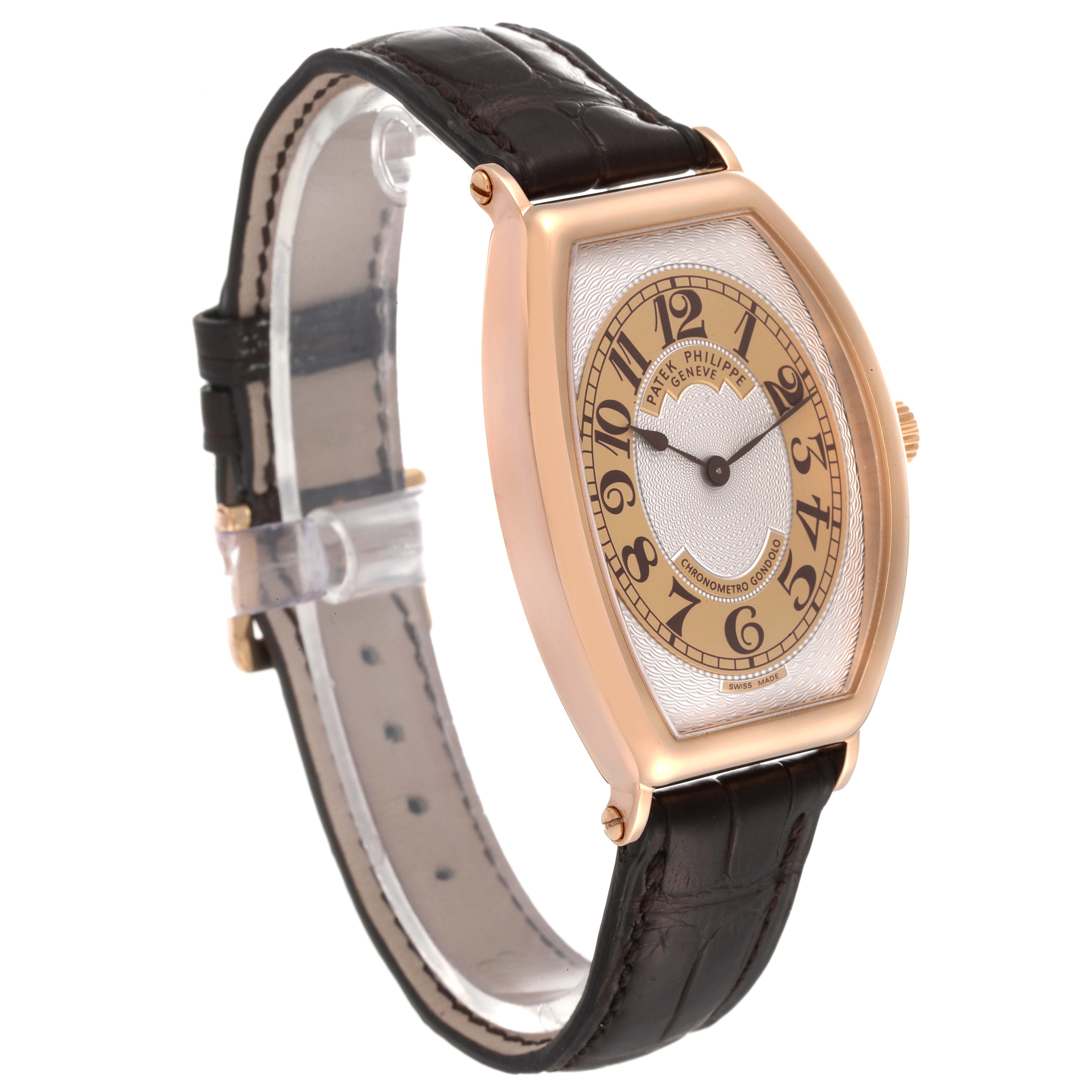 The image shows a Patek Philippe Gondolo 5098R Men
s Rose Gold Silver Dial 5098R Men
s Rose Gold Silver Dial watch at a three-quarter angle, highlighting its dial, case, and strap.