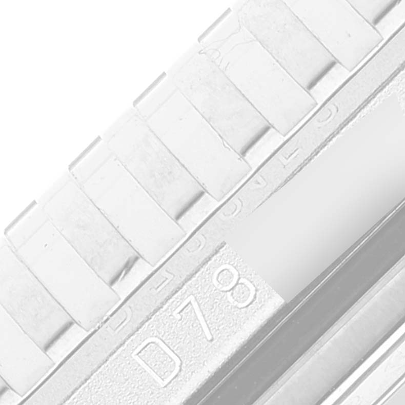 This image shows a close-up of the band and clasp of a Rolex Cellini 5441/9 Men
s White Gold Silver Dial 5441/9 Men
s White Gold Silver Dial watch, highlighting a section with an engraved code.