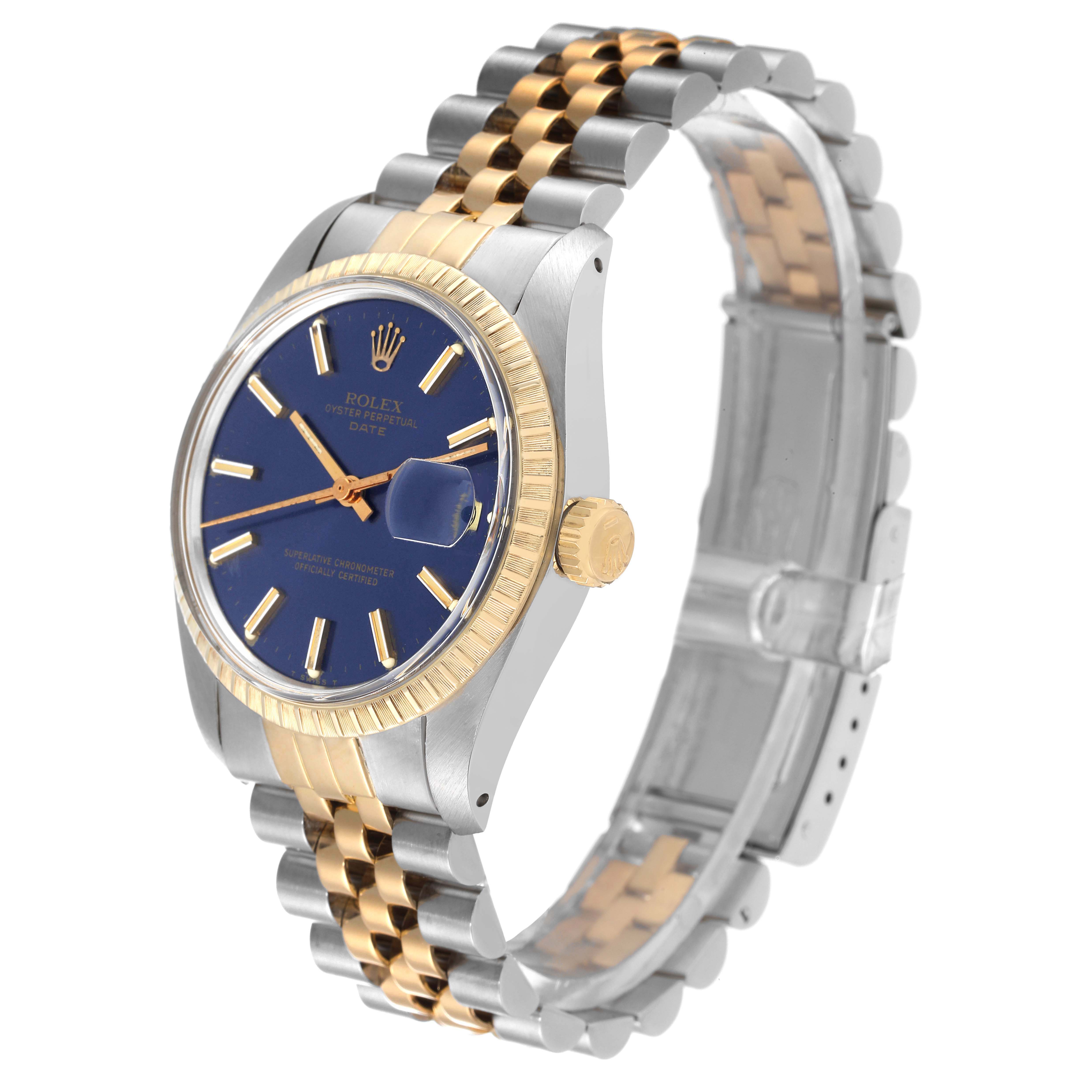 The image shows a side angle of a Vintage Collection Rolex watch, highlighting the blue dial, gold bezel, and two-tone bracelet.