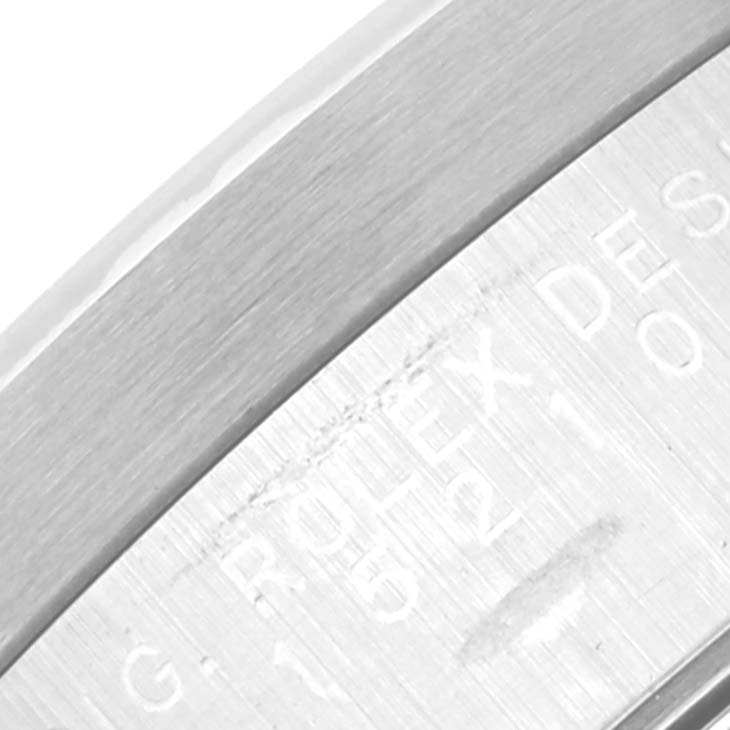 This image shows a close-up of the engraved details on the side of the case of the Rolex Date 15210 Men's Stainless Steel White Dial 15210 Men's Stainless Steel White Dial watch.
