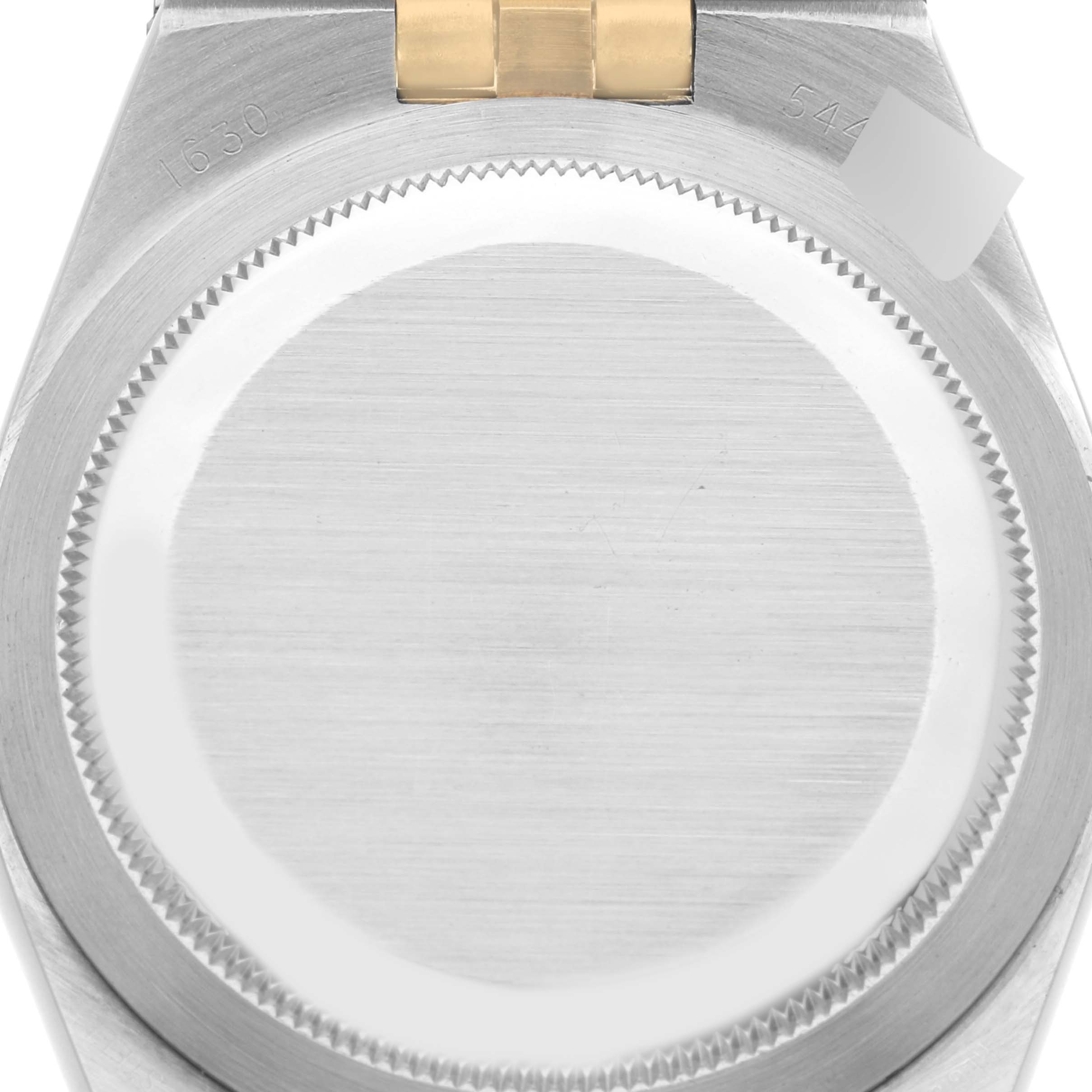 This image shows the back case of a Vintage Collection Rolex watch, highlighting the brushed stainless steel surface and part of the bracelet.