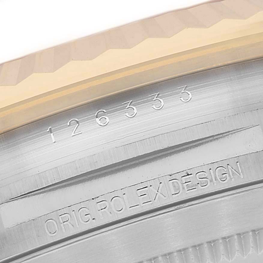 The image shows a close-up of the Rolex Datejust 41 126333 Men's Steel and Gold (two tone) Grey Dial 126333 Men's Steel and Gold (two tone) Grey Dial model's case, highlighting the model number and "ORIG. ROLEX DESIGN" engraving.