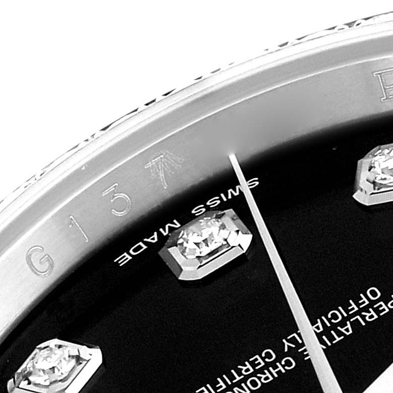 This image shows a close-up of the dial and edge of the bezel of the Rolex Datejust 116244 Men's Stainless Steel Black Dial 116244 Men's Stainless Steel Black Dial watch, displaying diamond markers and part of the "Swiss Made" text.