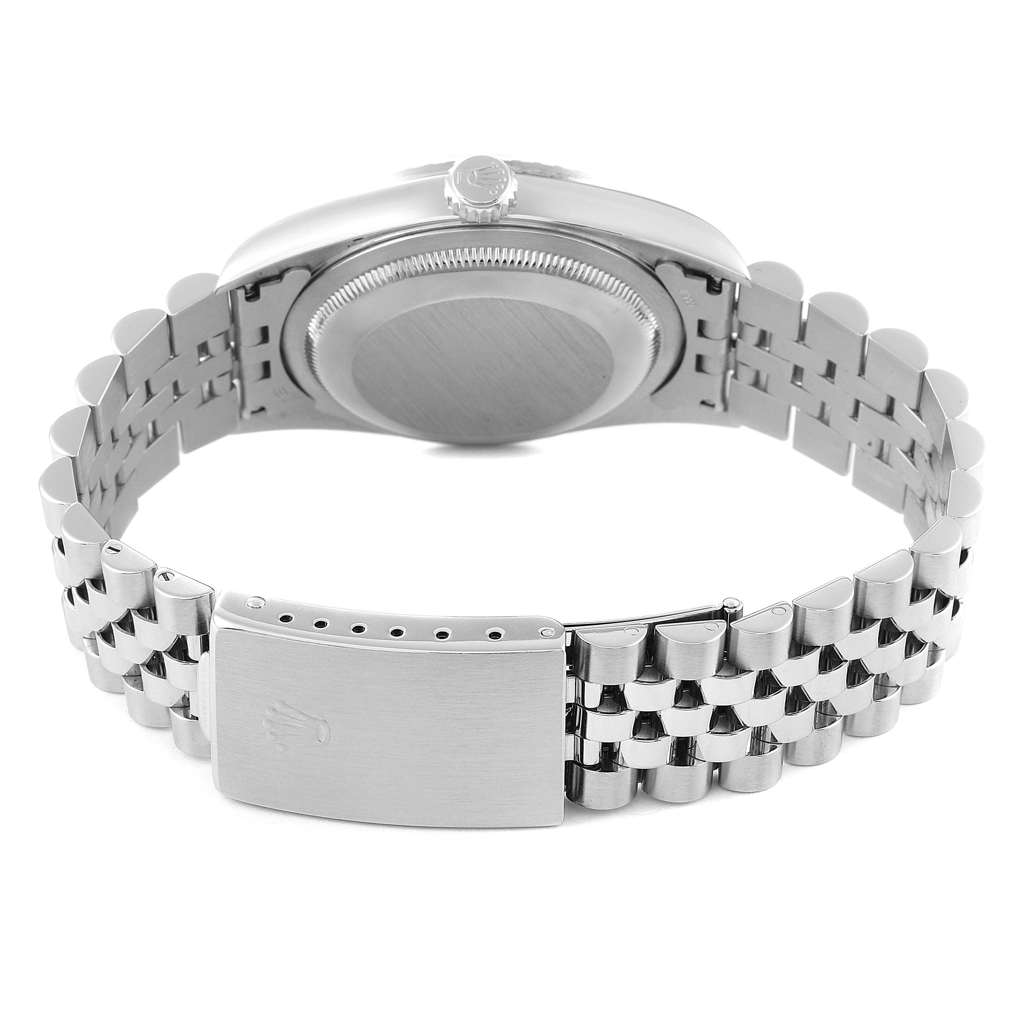 The image shows the back view of a Rolex Datejust 16220 Men's Stainless Steel Blue Dial 16220 Men's Stainless Steel Blue Dial watch, highlighting its clasp, bracelet, and case back.