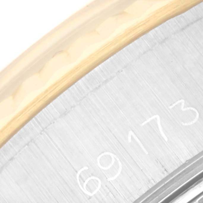 The image shows a close-up of the Rolex Datejust 69173 Women's Steel and Gold (two tone) Champagne Dial 69173 Women's Steel and Gold (two tone) Champagne Dial model 69173, highlighting part of the bezel and case.