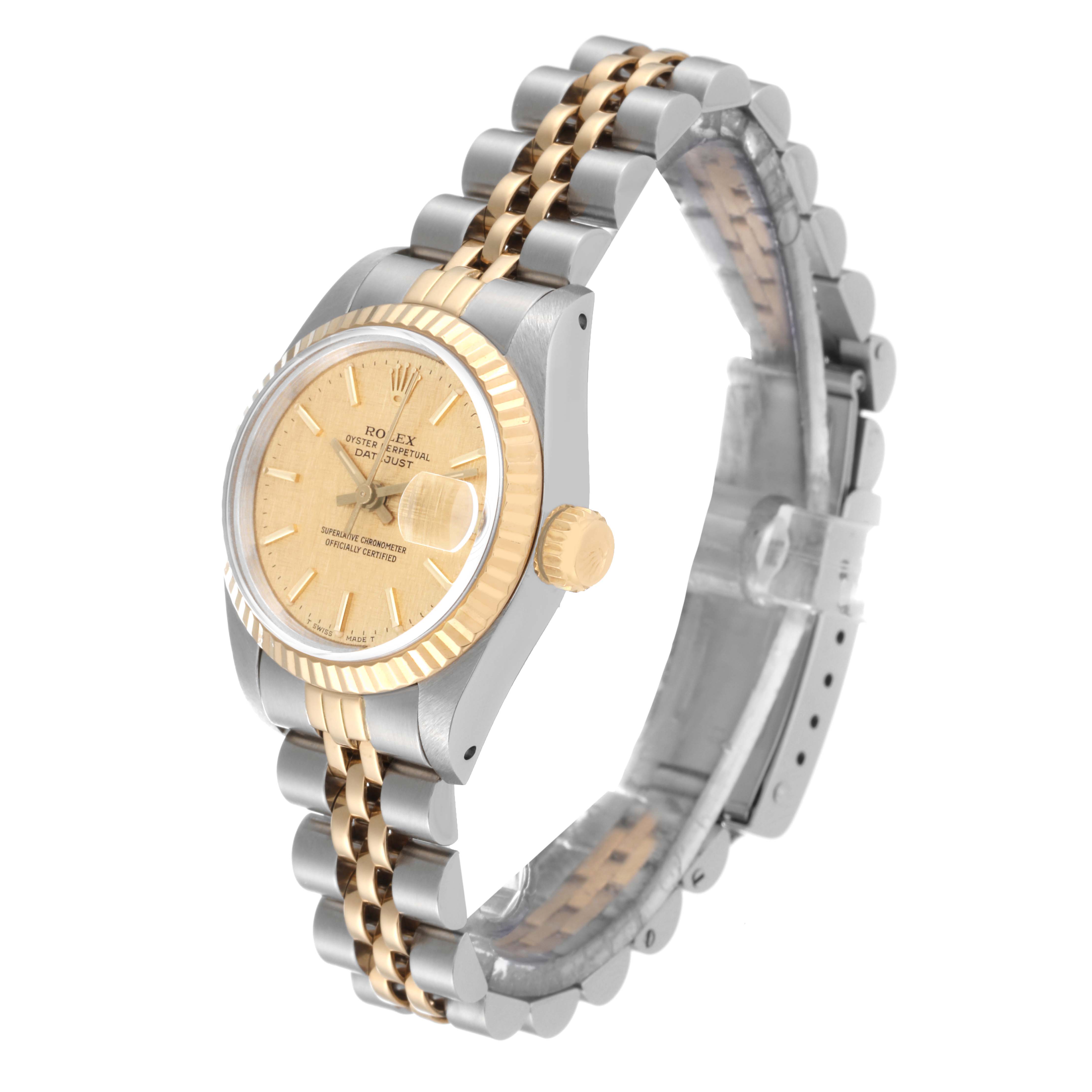 The image shows a Rolex Datejust 69173 Women's Steel and Gold (two tone) Champagne Dial 69173 Women's Steel and Gold (two tone) Champagne Dial watch at an angle highlighting its gold dial, two-tone metal bracelet, and a partially visible clasp.