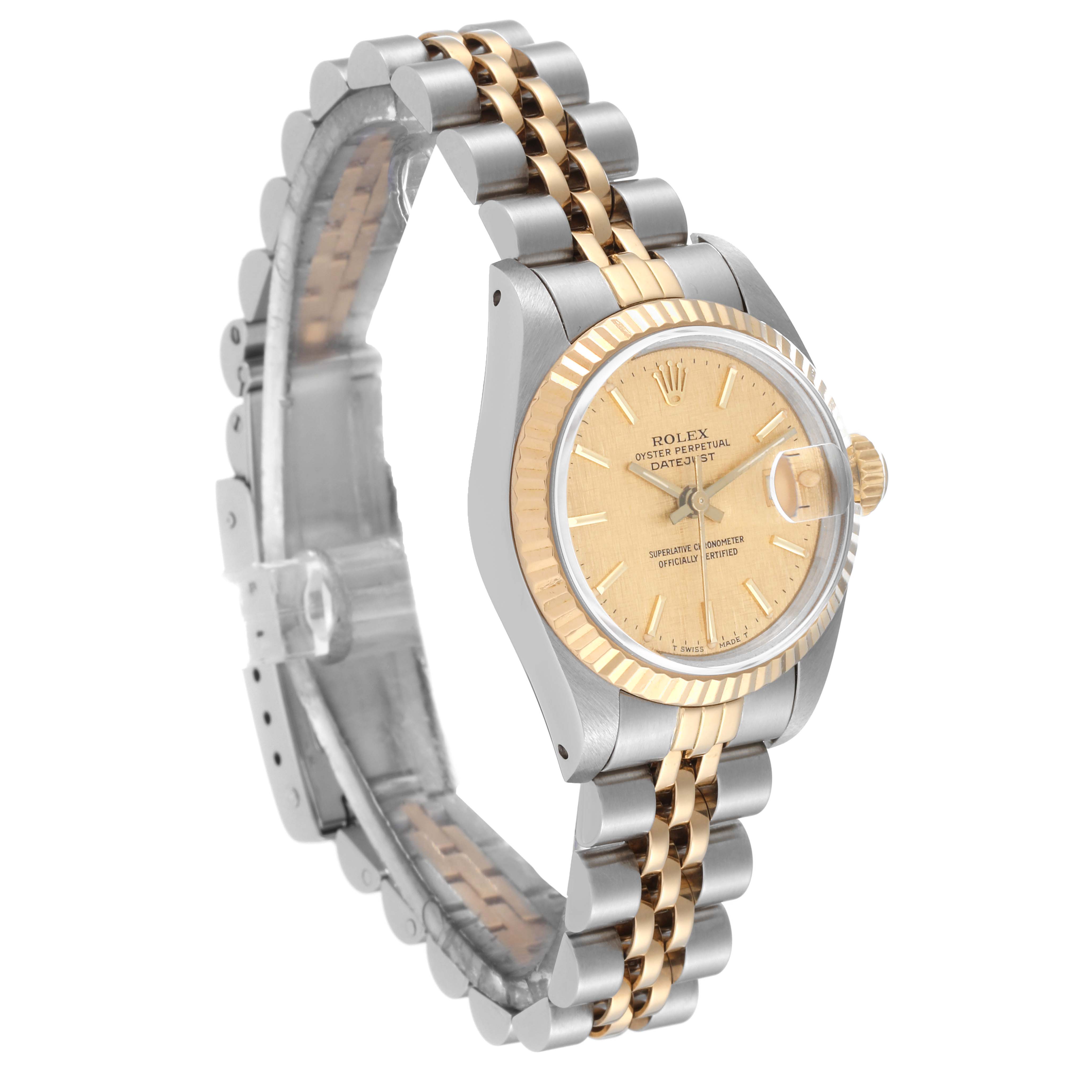 This image shows a Rolex Datejust 69173 Women's Steel and Gold (two tone) Champagne Dial 69173 Women's Steel and Gold (two tone) Champagne Dial watch angled to display its face, bezel, and two-tone jubilee bracelet.