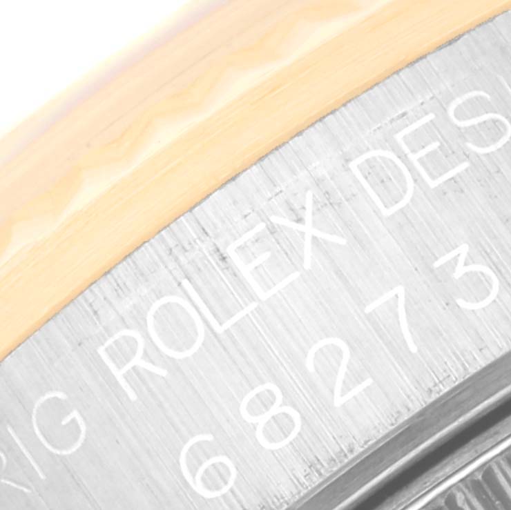 The image shows a close-up of the case back with engravings on the Rolex Mid-Size 68273 Women's Steel and Gold (two tone) Champagne Dial 68273 Women's Steel and Gold (two tone) Champagne Dial model watch.