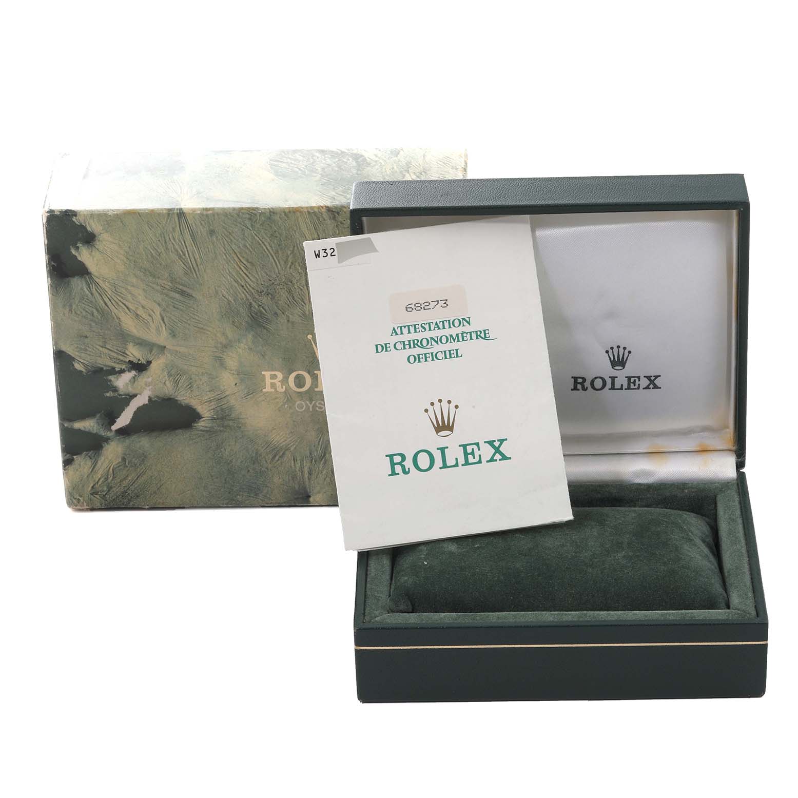 The image shows an open Rolex watch box and outer packaging, with a certificate partially placed inside the box.