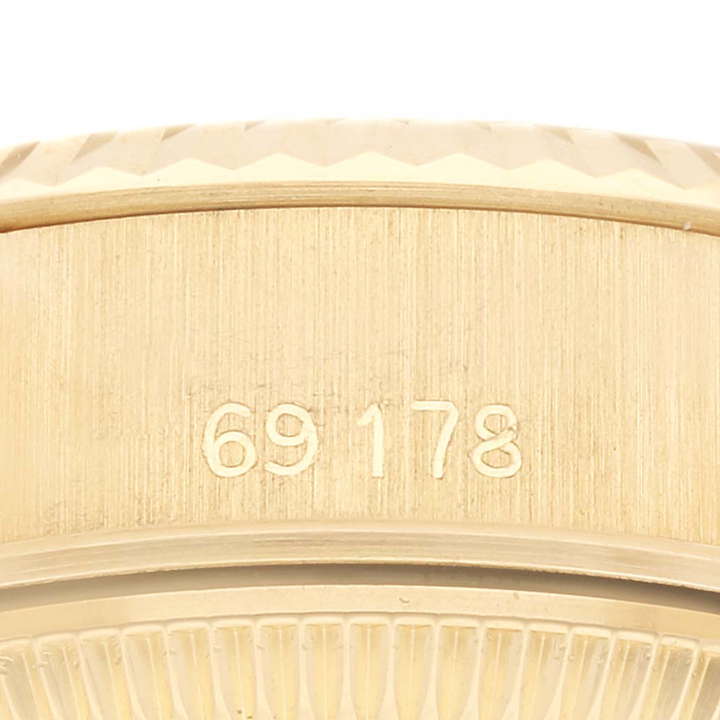 A close-up view of the side of a Rolex President 69178 Women
s Yellow Gold Champagne Dial 69178 Women
s Yellow Gold Champagne Dial model watch, displaying the model number "69178".