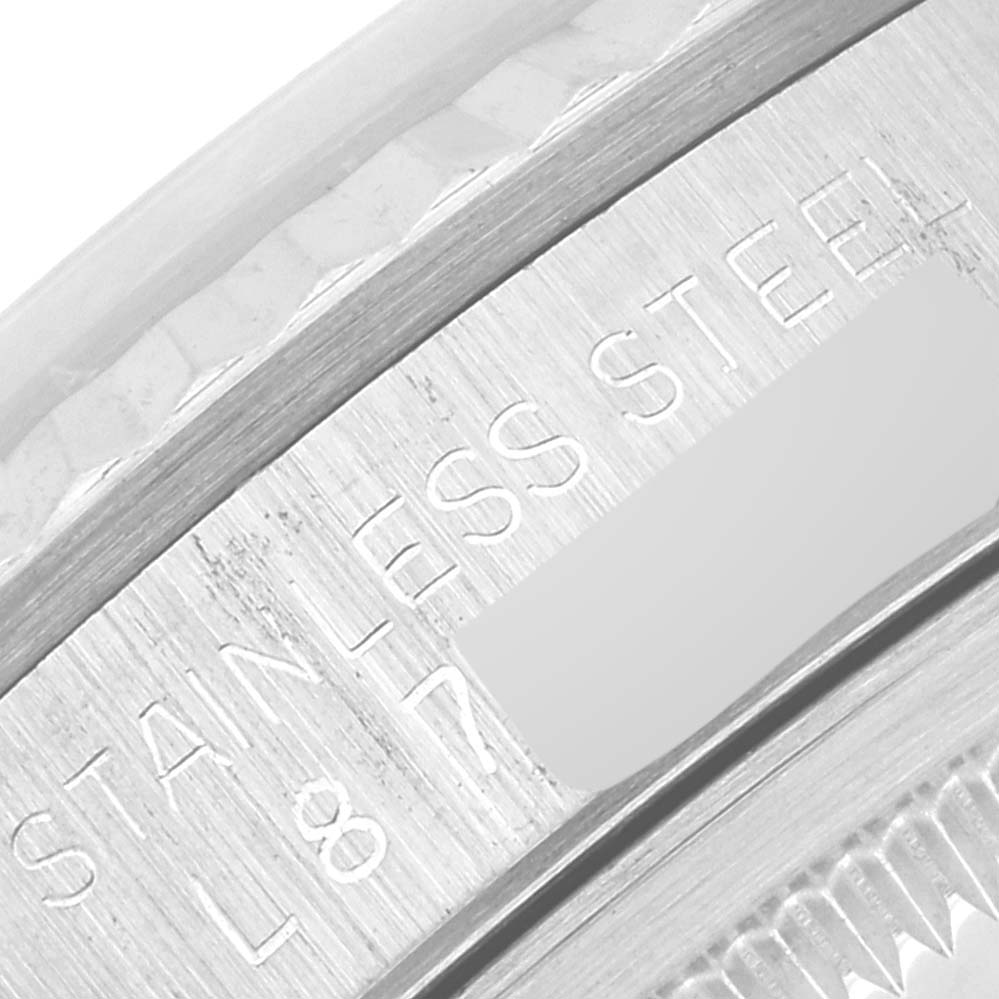 This close-up image shows the stainless steel engraving on the inner bezel of a Rolex Datejust 16234 Men's Stainless Steel Silver Dial 16234 Men's Stainless Steel Silver Dial watch.