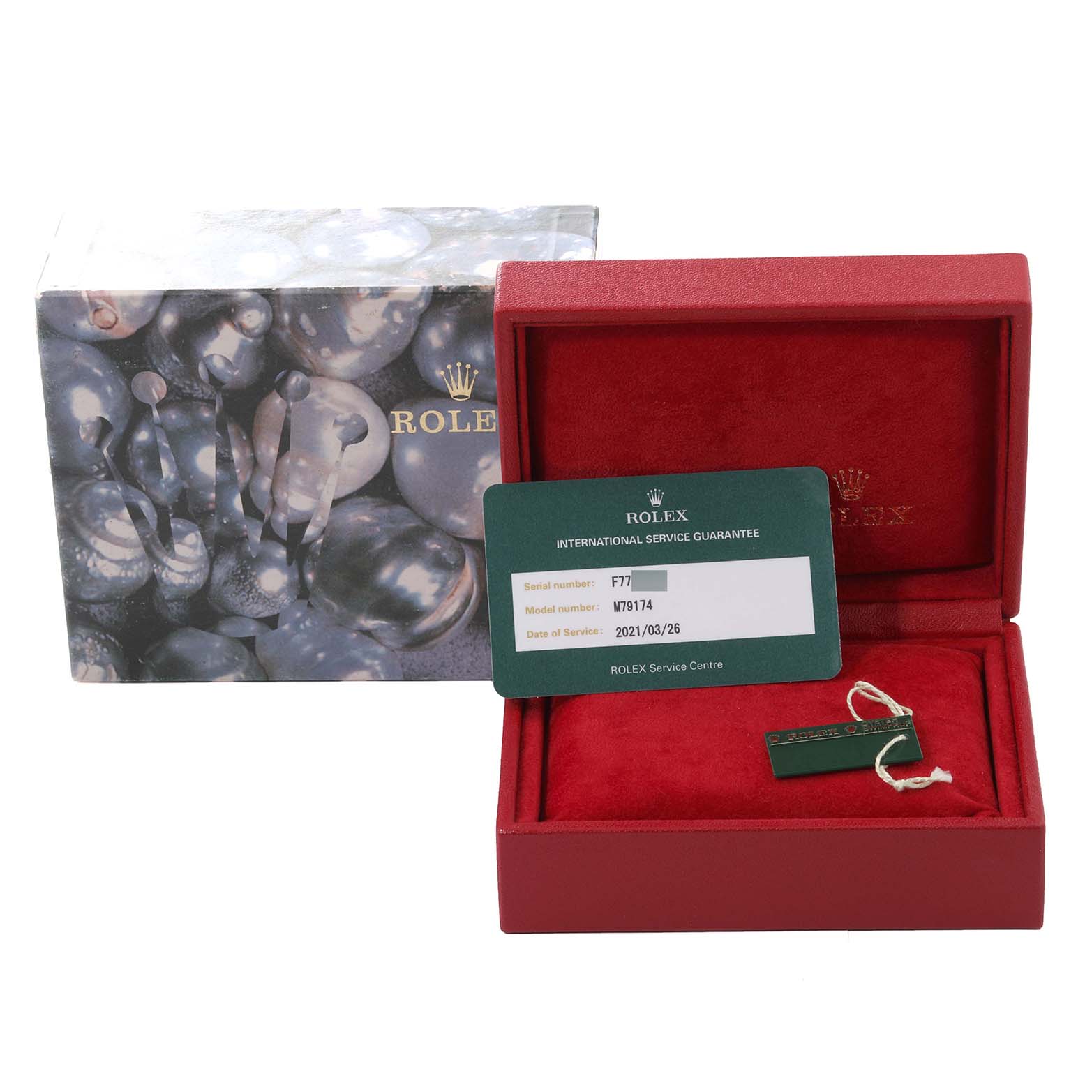 The image shows a Rolex Datejust 79174 Women's Stainless Steel Silver Dial 79174 Women's Stainless Steel Silver Dial box and guarantee card placed inside the opened watch box.