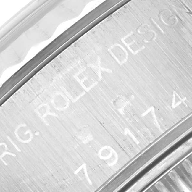 This close-up image shows the engraved serial number and "Rolex Design" text on the outer rim of a Rolex Datejust 79174 Women's Stainless Steel Silver Dial 79174 Women's Stainless Steel Silver Dial watch.