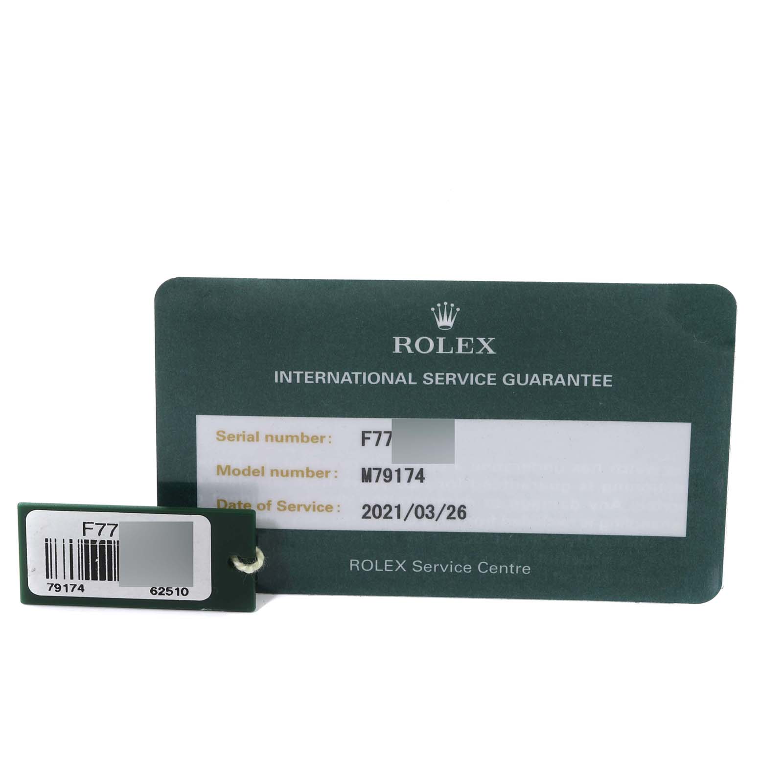 The image shows a Rolex International Service Guarantee card and a green tag for the Rolex Datejust 79174 Women's Stainless Steel Silver Dial 79174 Women's Stainless Steel Silver Dial model M79174.