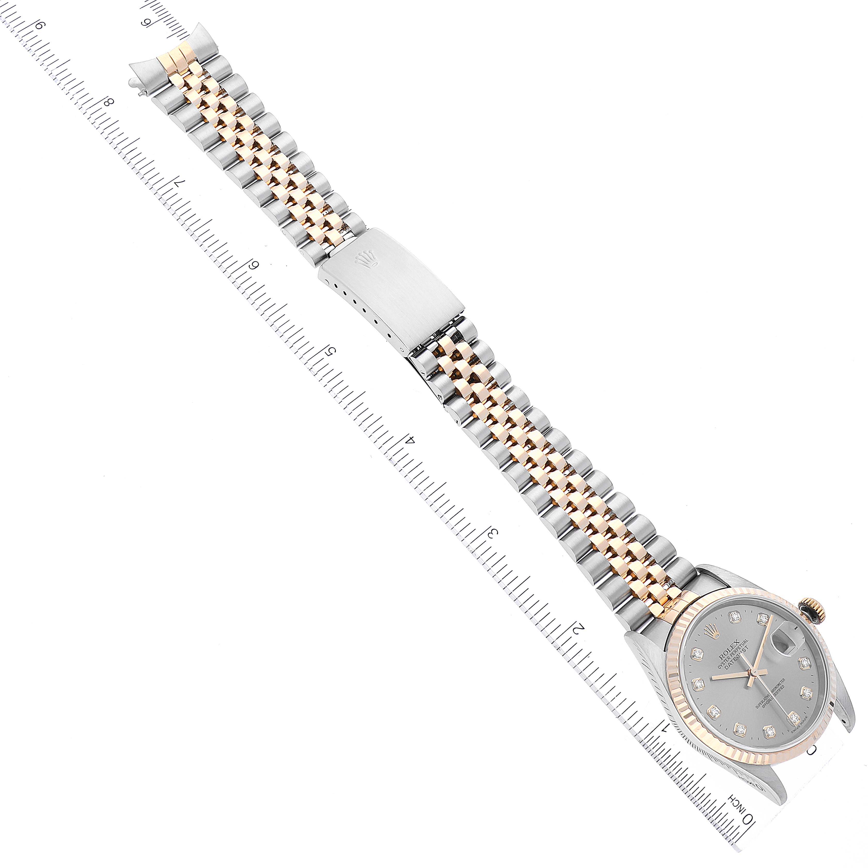 The image shows a Rolex Datejust 16233 Men's Steel and Gold (two tone) Grey Dial 16233 Men's Steel and Gold (two tone) Grey Dial watch laid flat, displaying the bracelet, clasp, and watch face, aligned with a ruler.