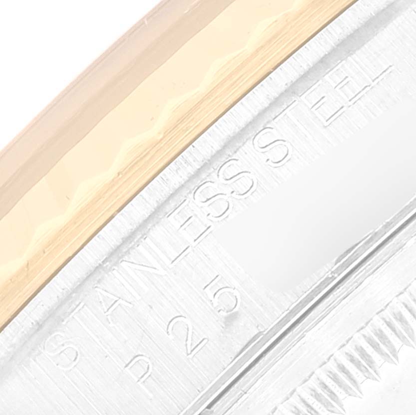 This image shows a close-up of the stainless steel casing and the edge of the bezel of a Rolex Datejust 16233 Men's Steel and Gold (two tone) Grey Dial 16233 Men's Steel and Gold (two tone) Grey Dial watch.