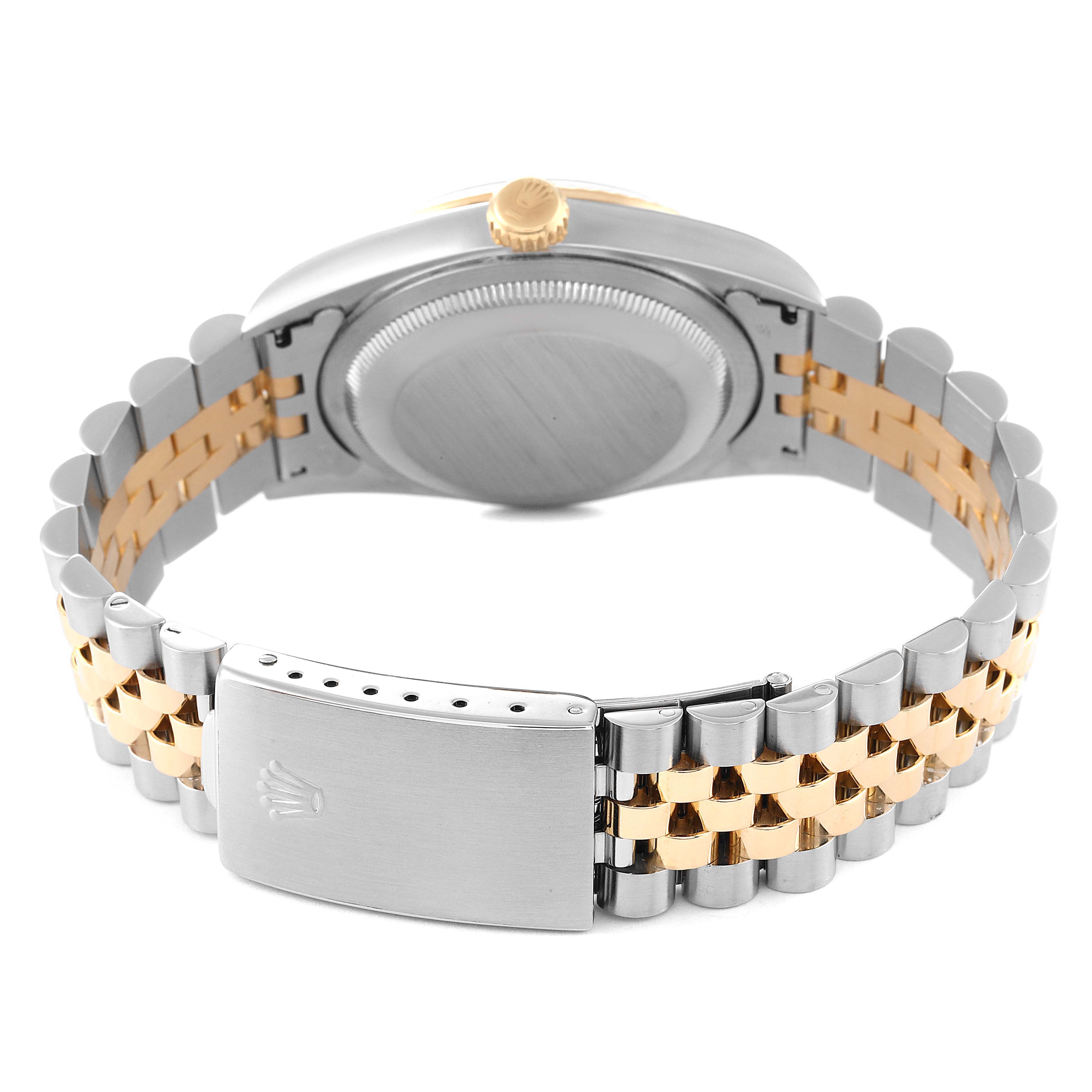 The image shows the back view of a Rolex Datejust 16233 Men's Steel and Gold (two tone) Champagne Dial 16233 Men's Steel and Gold (two tone) Champagne Dial watch, focusing on the clasp, bracelet, and case back.