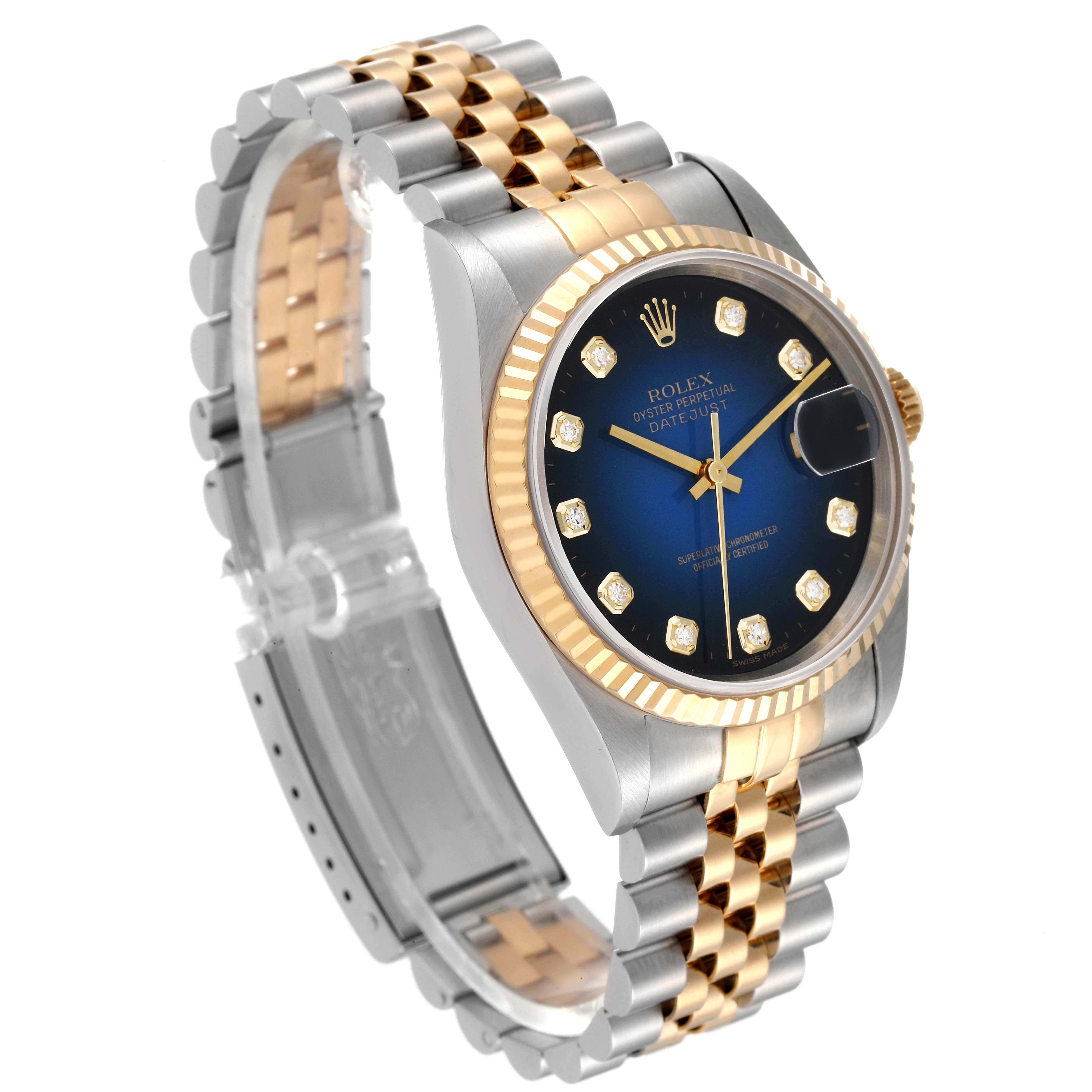 The Rolex Datejust 16233 Men's Steel and Gold (two tone) Blue Dial 16233 Men's Steel and Gold (two tone) Blue Dial watch is shown at a three-quarter angle, displaying its two-tone bracelet, blue dial with diamond markers, and fluted bezel.