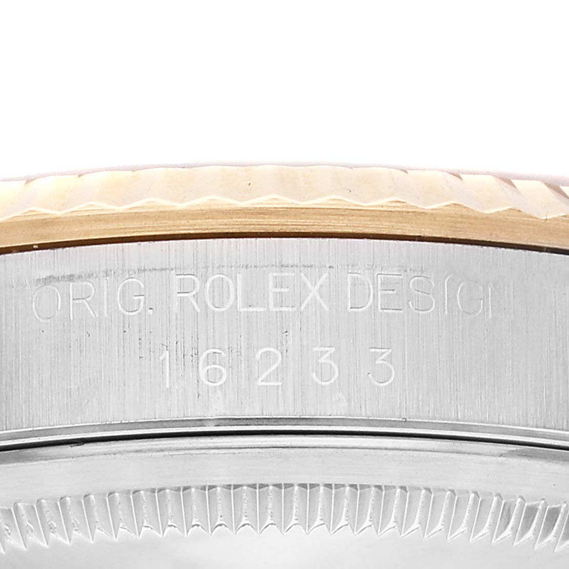 This image shows the side engraving of a Rolex Datejust 16233 Men's Steel and Gold (two tone) Blue Dial 16233 Men's Steel and Gold (two tone) Blue Dial watch, detailing the model number and "Rolex Design" text.