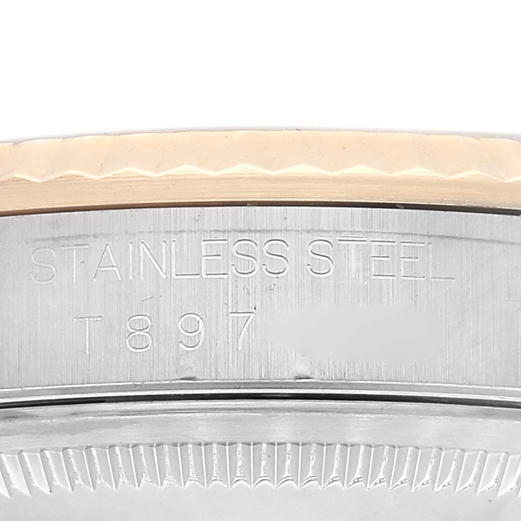 The image shows the side of the stainless steel casing with markings for the Rolex Datejust 16233 Men's Steel and Gold (two tone) Blue Dial 16233 Men's Steel and Gold (two tone) Blue Dial model.