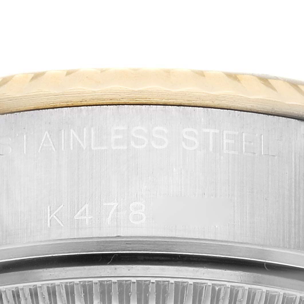 This image shows a close-up of the side engraving on a Rolex Datejust 79173G Women's Steel and Gold (two tone) Champagne Dial 79173G Women's Steel and Gold (two tone) Champagne Dial watch, highlighting the stainless steel and model details.