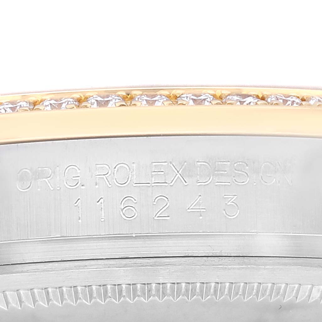 This image shows an angled close-up of the model number and part of the bezel of a Rolex Datejust 116243 Men's Steel and Gold (two tone) Champagne Dial 116243 Men's Steel and Gold (two tone) Champagne Dial watch.