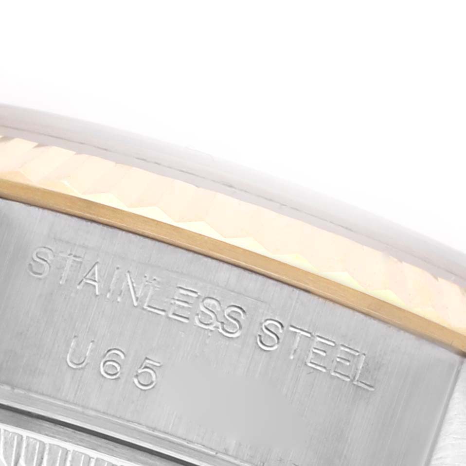 The image shows a close-up of the Rolex Datejust 69173 Women's Steel and Gold (two tone) Champagne Dial 69173 Women's Steel and Gold (two tone) Champagne Dial case side, highlighting the "STAINLESS STEEL" engraving.