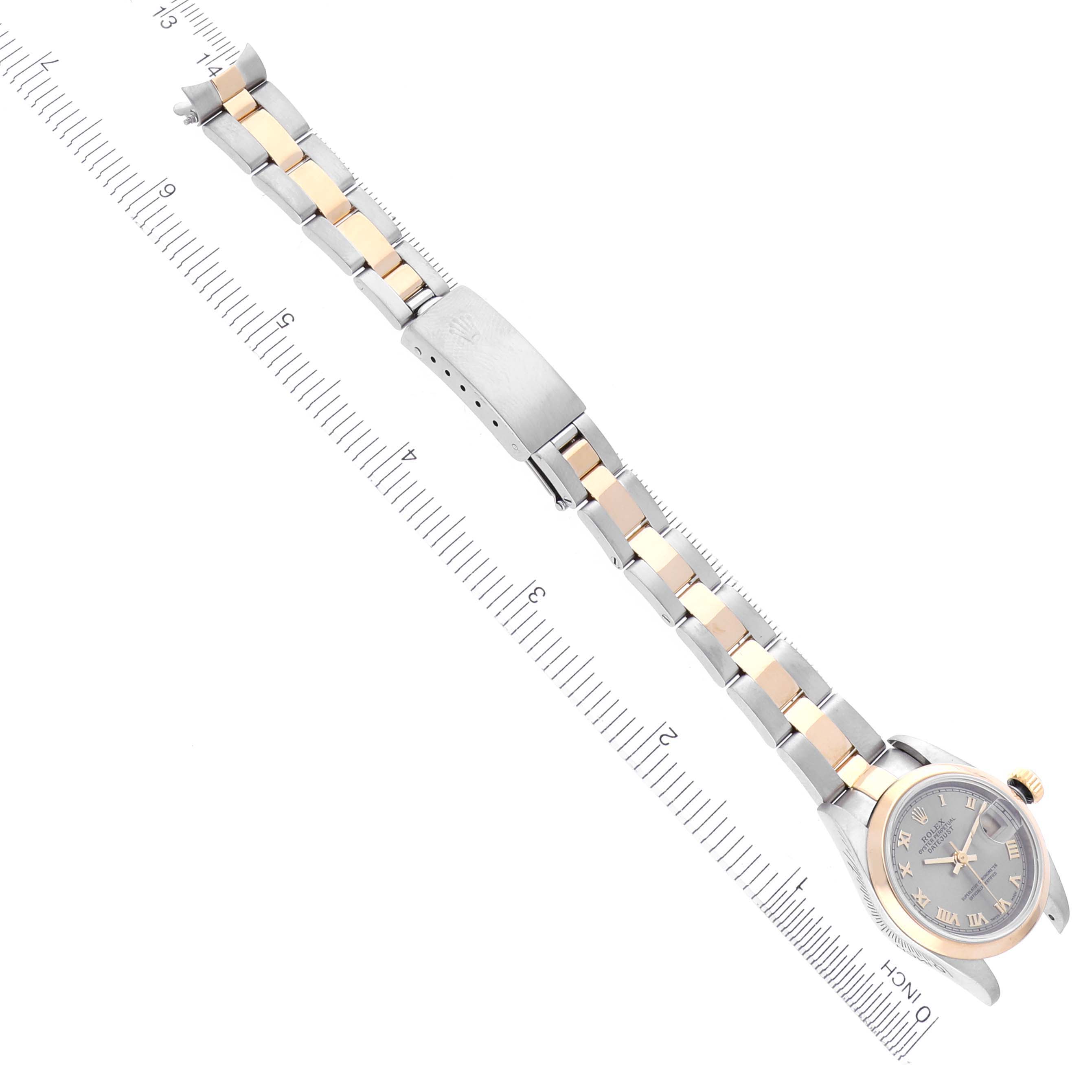 The Rolex Datejust 79163 Women's Steel and Gold (two tone) Grey Dial 79163 Women's Steel and Gold (two tone) Grey Dial watch is shown at an angle, displaying the full bracelet, clasp, and face, aligned with a measuring ruler.