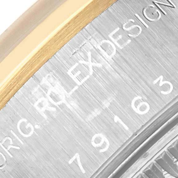 The image shows a close-up of the bezel and inner rim of a Rolex Datejust 79163 Women's Steel and Gold (two tone) Grey Dial 79163 Women's Steel and Gold (two tone) Grey Dial, highlighting the engravings.