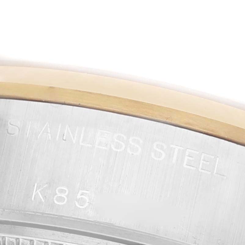 The image shows a close-up of the Rolex Datejust 79163 Women's Steel and Gold (two tone) White Dial 79163 Women's Steel and Gold (two tone) White Dial watch's outer rim, highlighting the edge and part of the engraving.