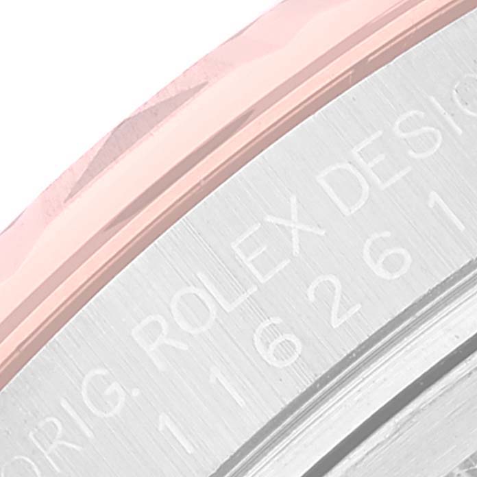 This image shows a close-up angle of the engraved casing of a Rolex Turn-o-Graph 116261 Men's Steel and Gold (two tone) Black Dial 116261 Men's Steel and Gold (two tone) Black Dial watch.