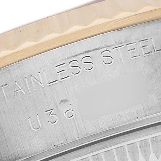 The image shows a close-up of the stainless steel outer casing with engravings on a Rolex Datejust 69173 Women's Steel and Gold (two tone) White Dial 69173 Women's Steel and Gold (two tone) White Dial watch.