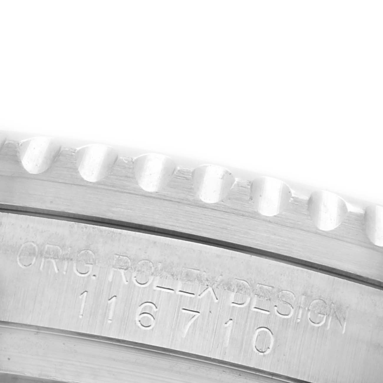 The image shows a close-up of the engraved bezel side and case edge of a Rolex GMT-Master 116710LN Men's Stainless Steel Black Dial 116710LN Men's Stainless Steel Black Dial.