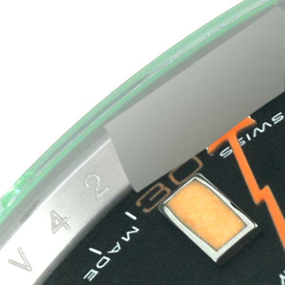 The close-up image shows the bezel and a portion of the dial of a Rolex Milgauss 116400GV Men's Stainless Steel Black Dial 116400GV Men's Stainless Steel Black Dial watch.