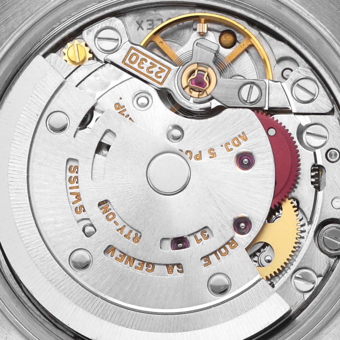 The image shows a close-up of the movement mechanism inside a Rolex Oyster Perpetual 76080 Women's Stainless Steel Blue Dial 76080 Women's Stainless Steel Blue Dial watch.