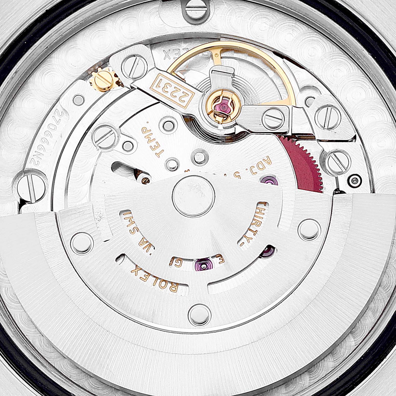 The image shows the intricate inner mechanisms of a Mid-Size Rolex watch, viewed from the back.