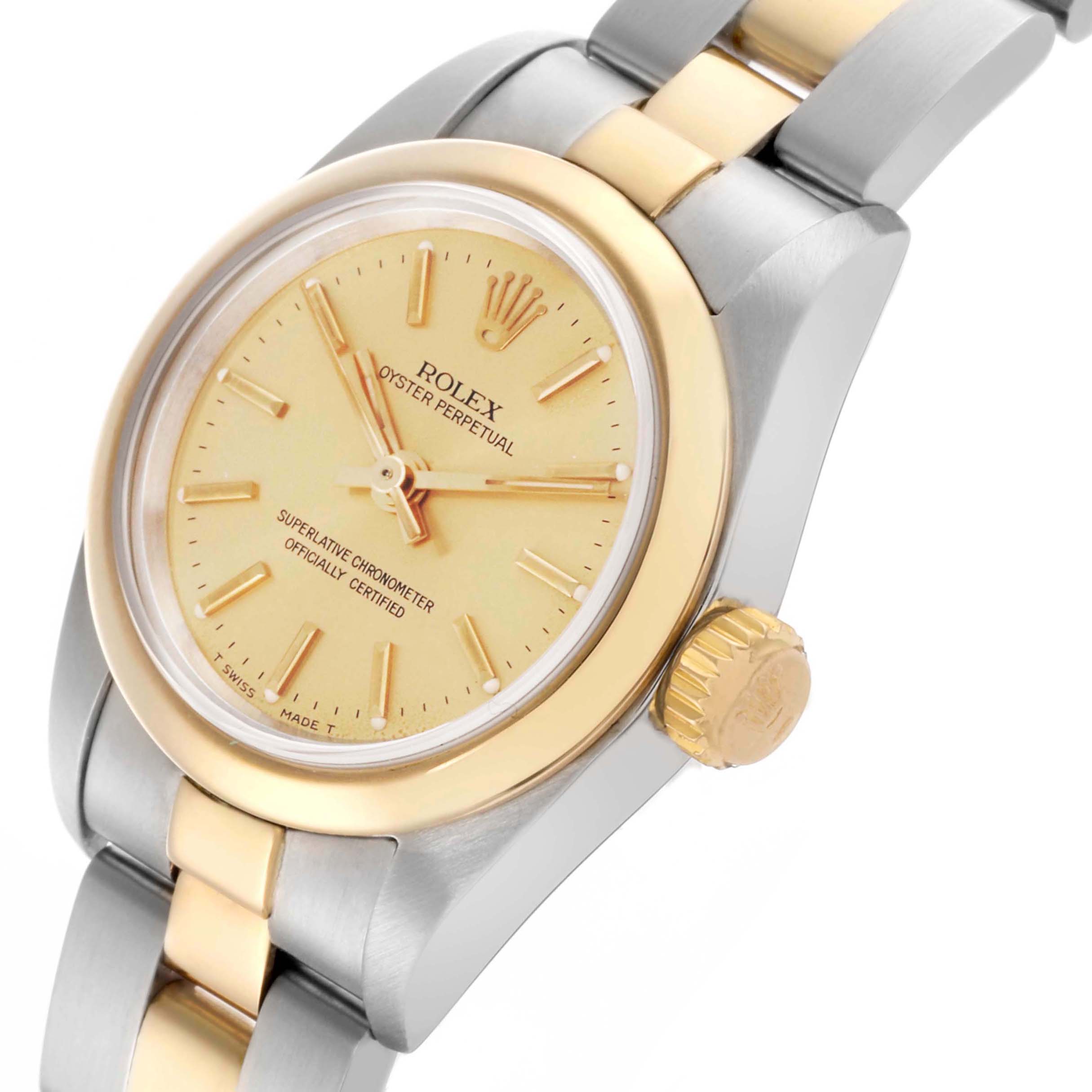 The image shows a Rolex Oyster Perpetual 67183 Women's Steel and Gold (two tone) Champagne Dial 67183 Women's Steel and Gold (two tone) Champagne Dial watch at an angled view, highlighting the dial, bezel, crown, and bracelet.
